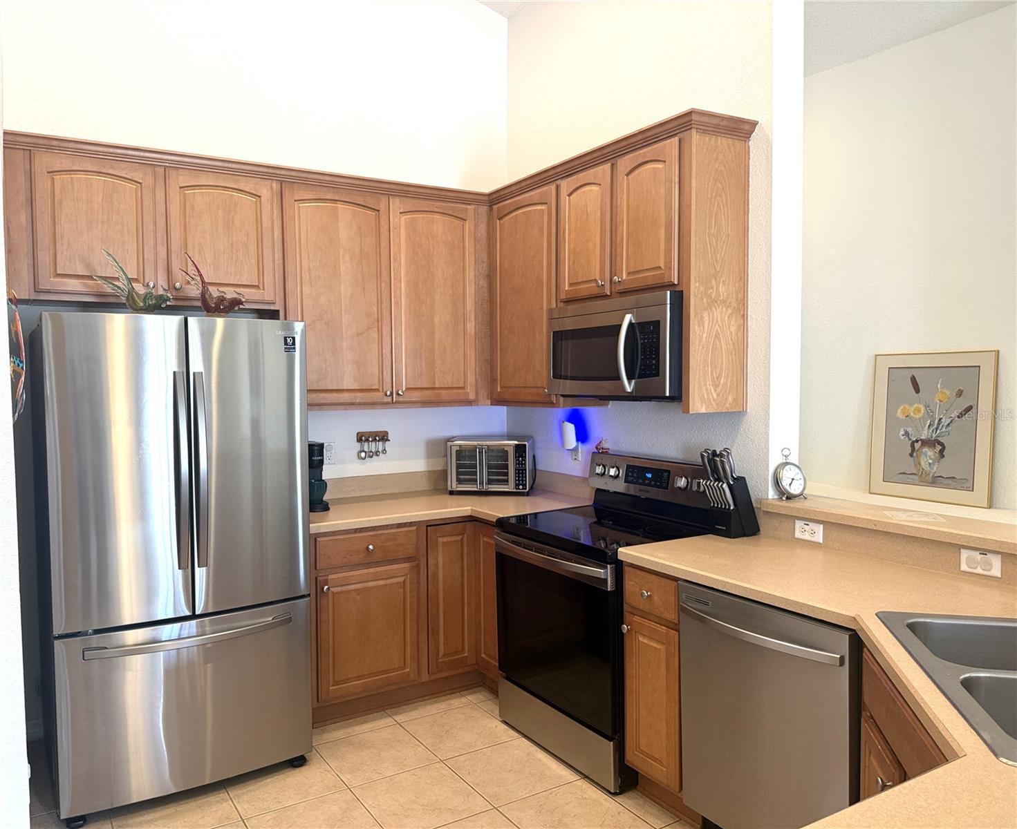 kitchen with Stainless Steel appliances and 42" oak cabinets.