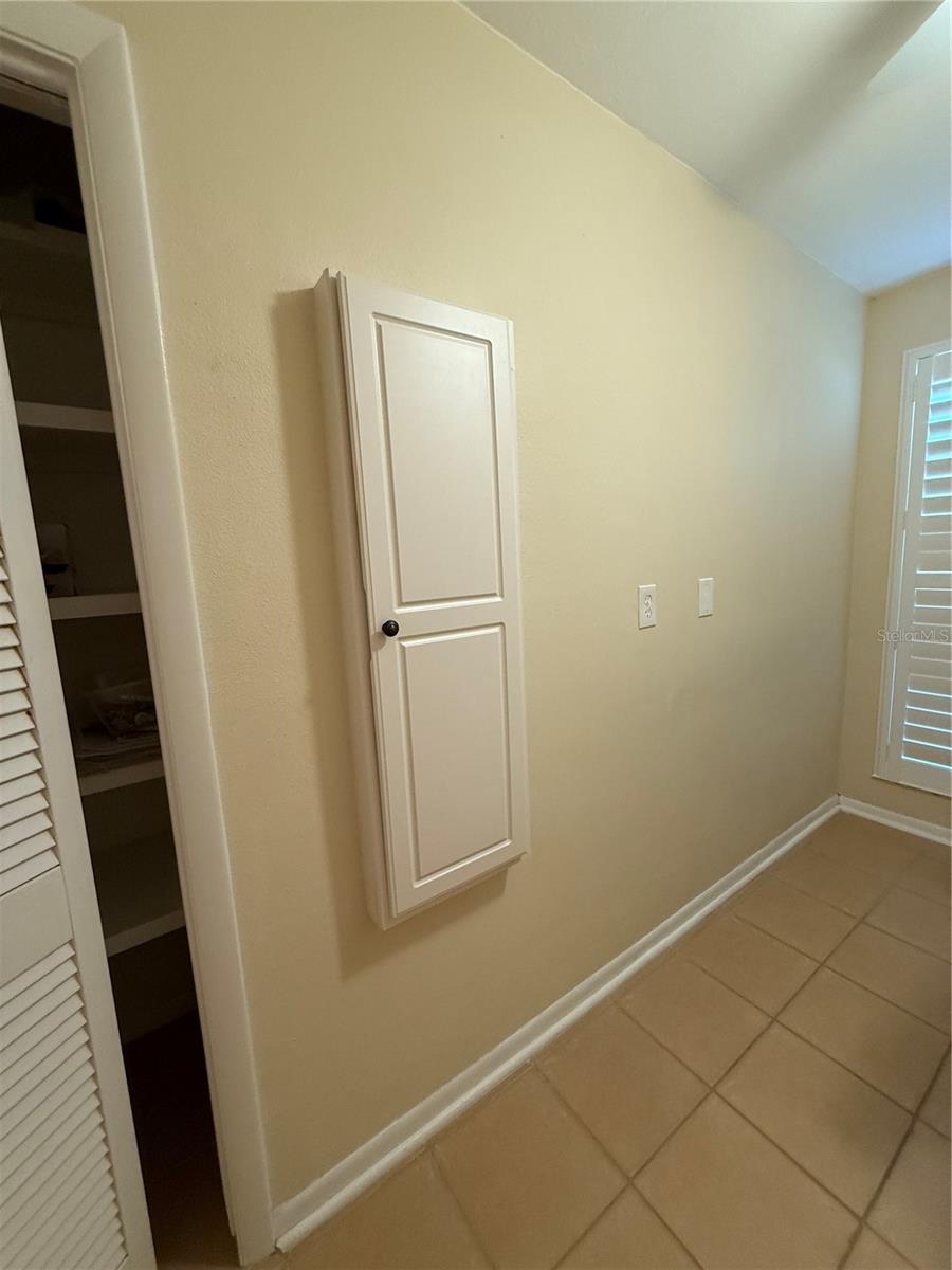 built in ironing board in Laundry room