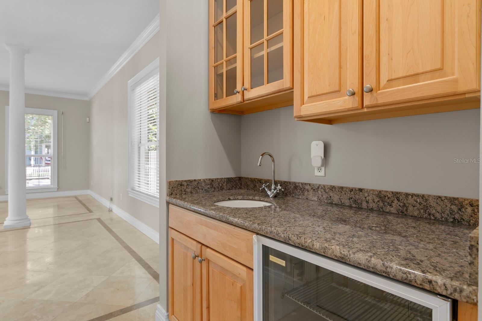 3rd sink and wine fridge in the butler's pantry area across from the walk-in pantry