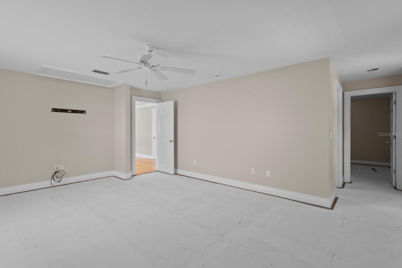 Primary suite leading into primary bath and bonus office area