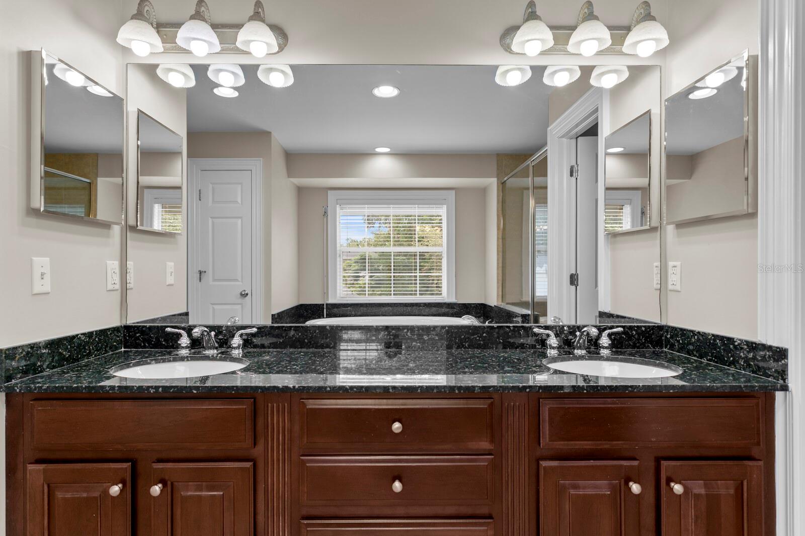 Dual sinks and granite counters in primary bath