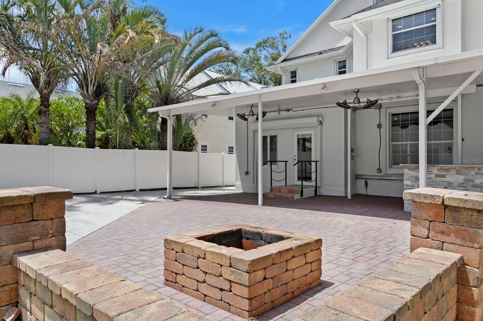 Enjoy Florida nights beside the backyard fire pit