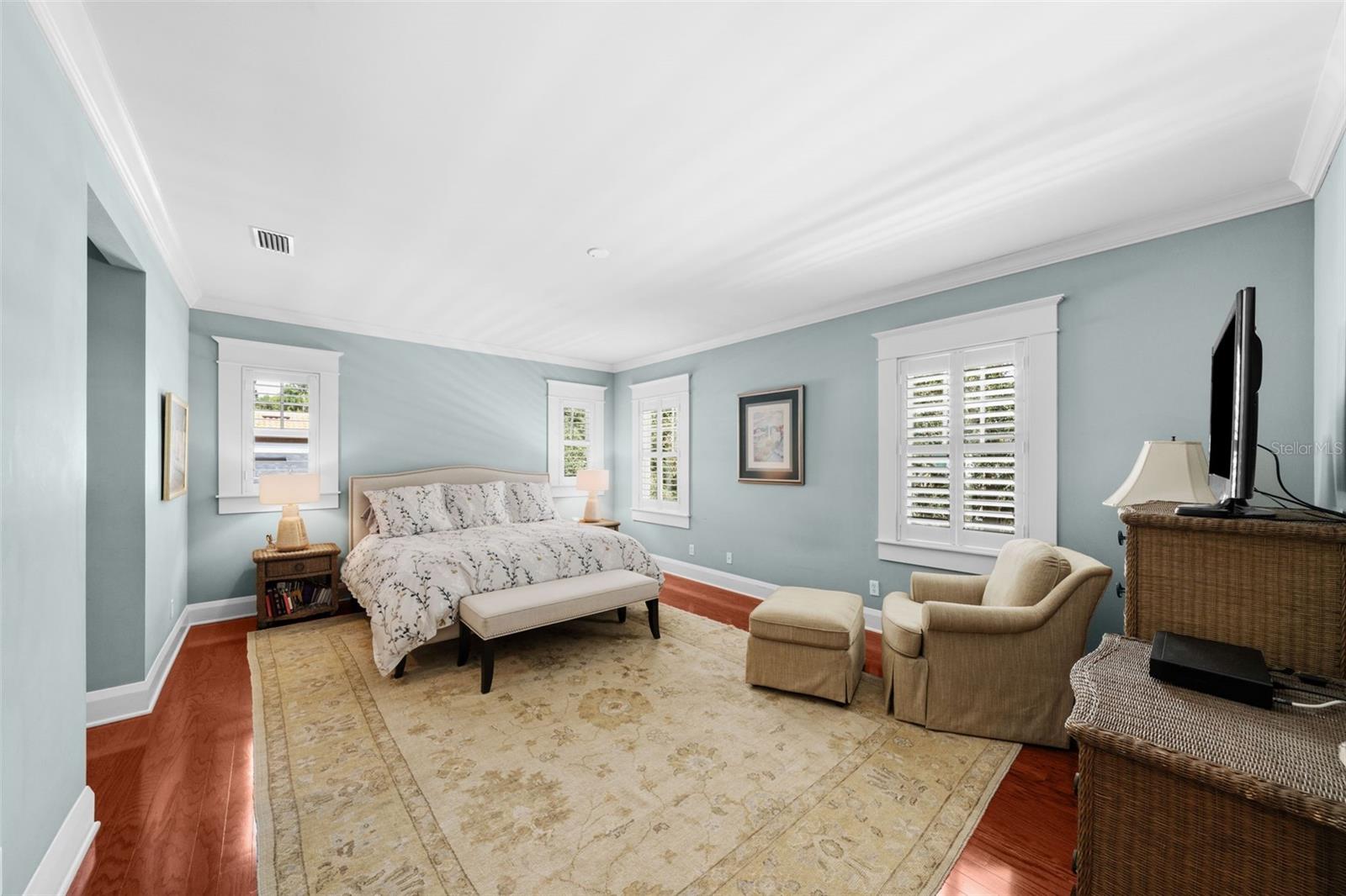 Primary bedroom is spacious and offers two walk in closets