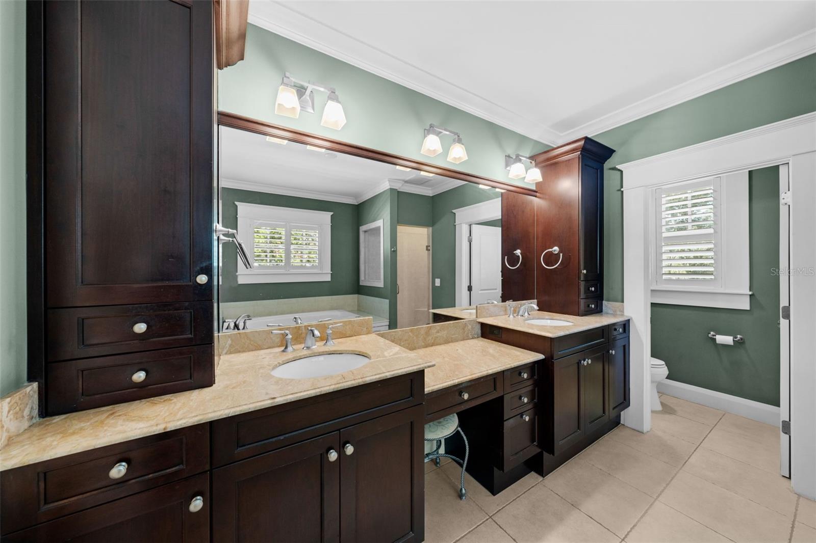 Dual sink vanity with make up area and added storage