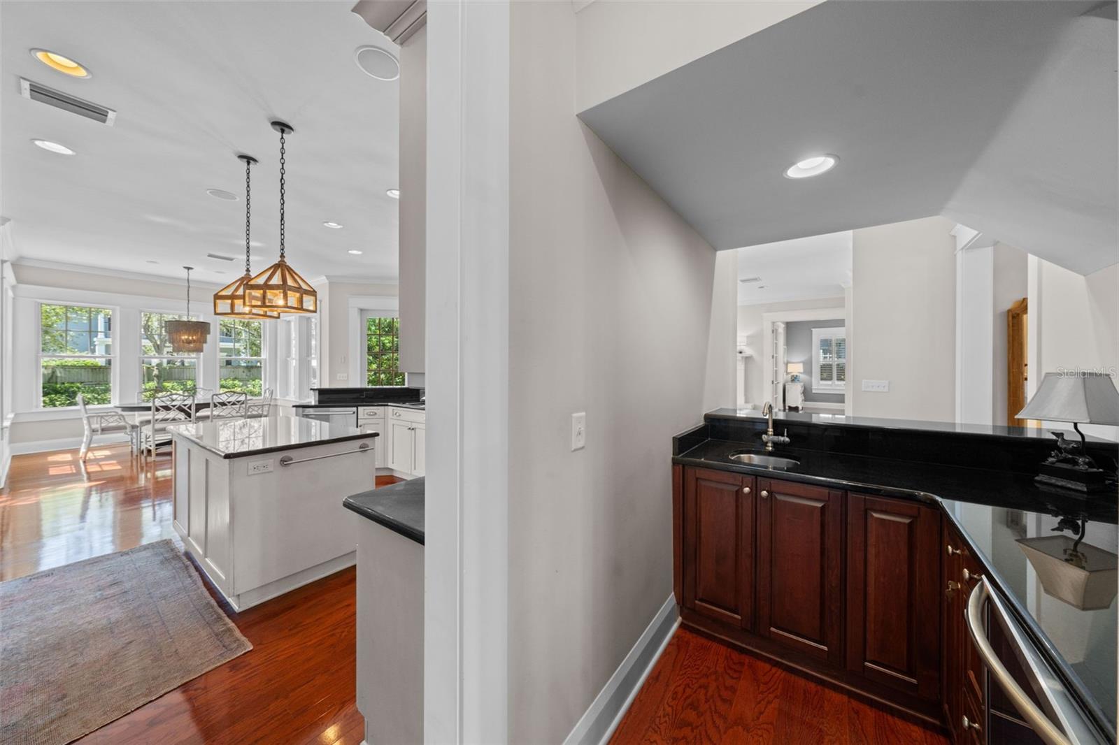 Between the kitchen and dining room is an entertainment bar