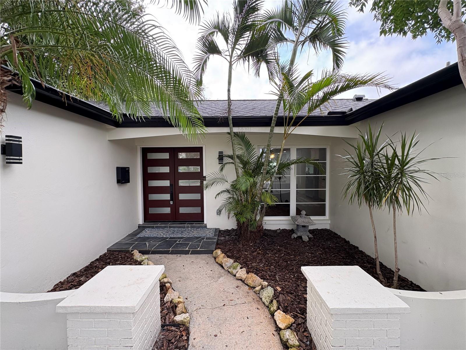 New double doors, lighting and landscaping