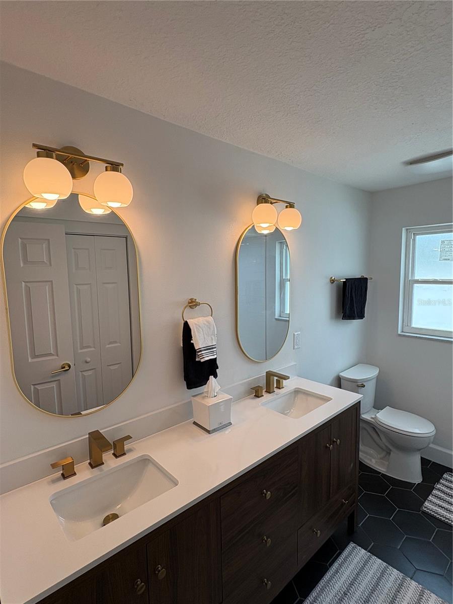 The main bath has double vanities as well