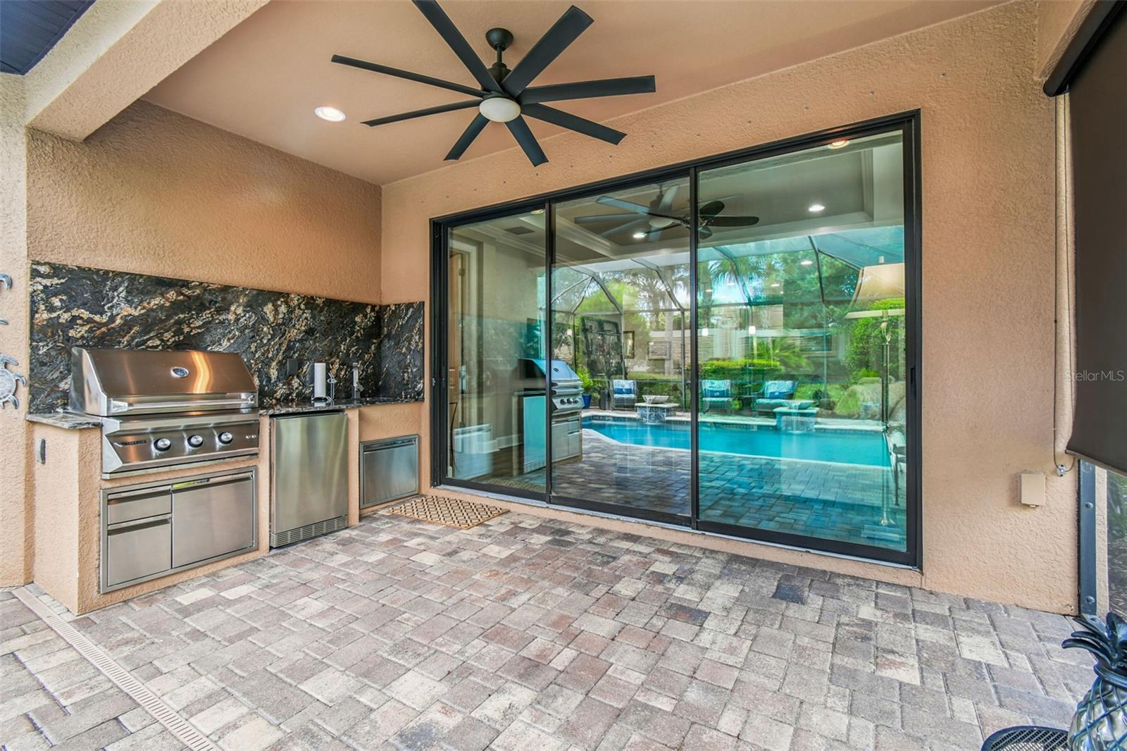 3 panel glass sliding doors with motorized privacy shades