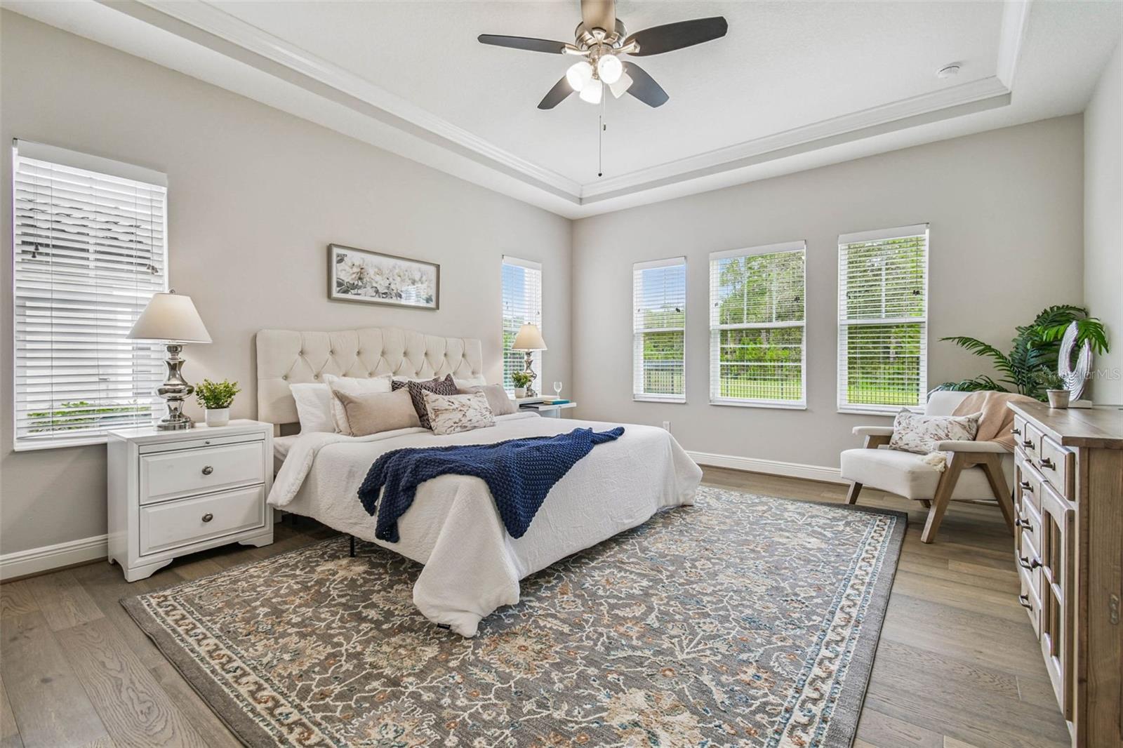 Primary suite with natural lighting and privacy on main floor