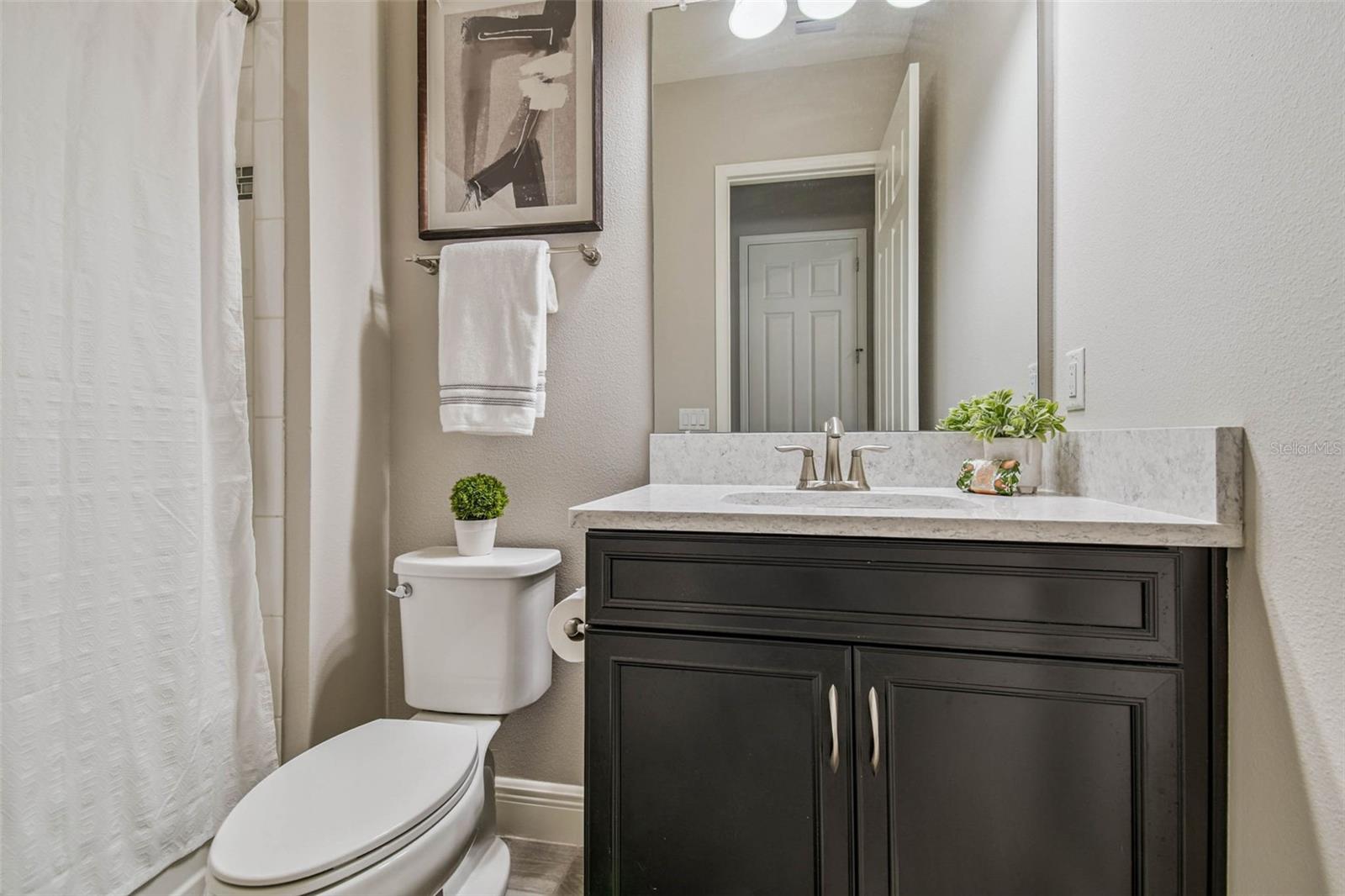 FULL bathroom next to another spacious main floor room