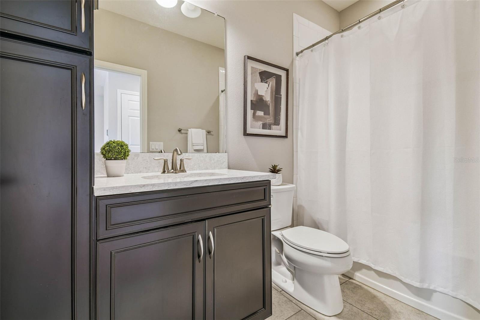 FULL bathroom with built in cabinetry