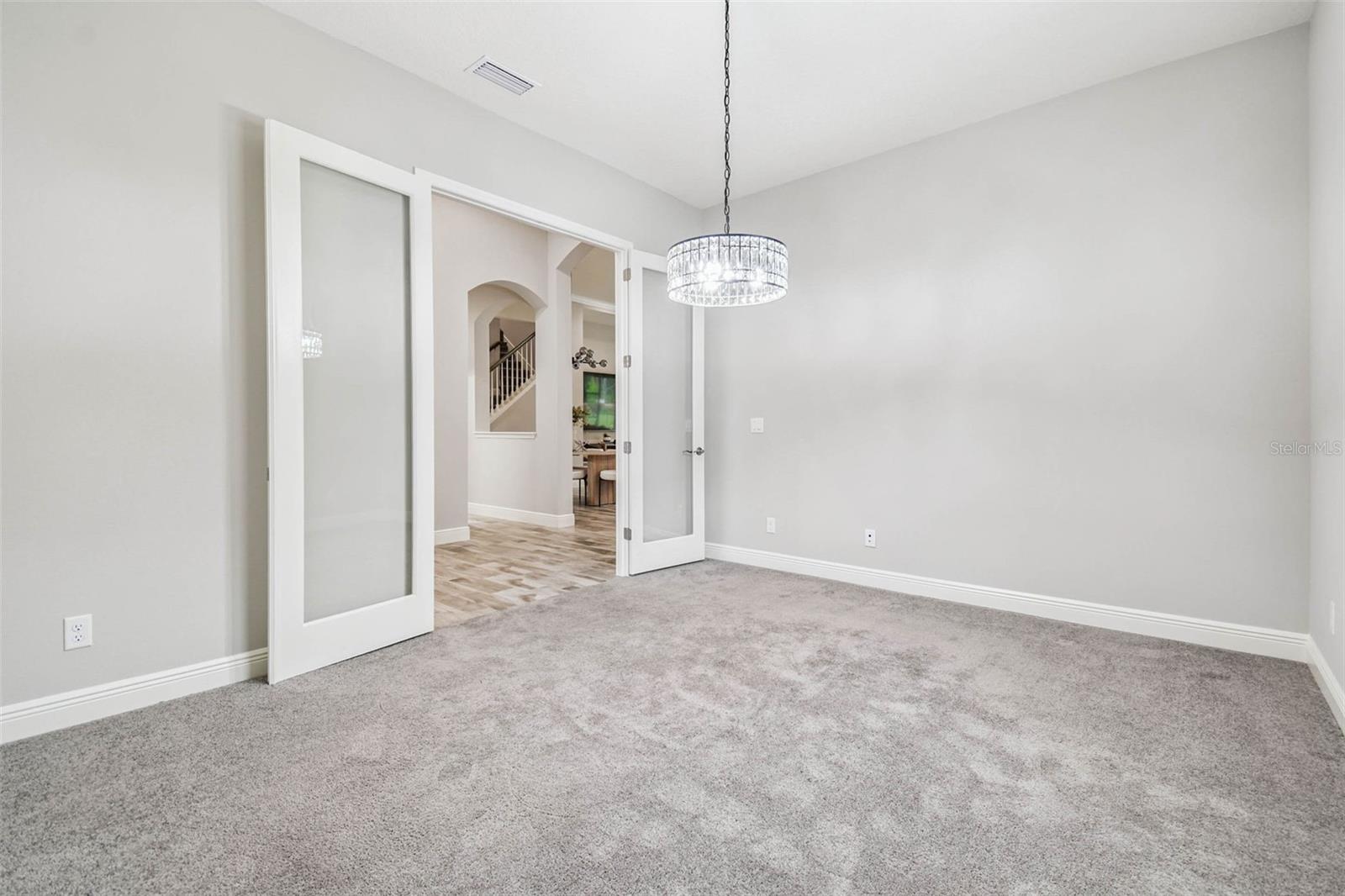 Spacious office/flex space with french glass doors.