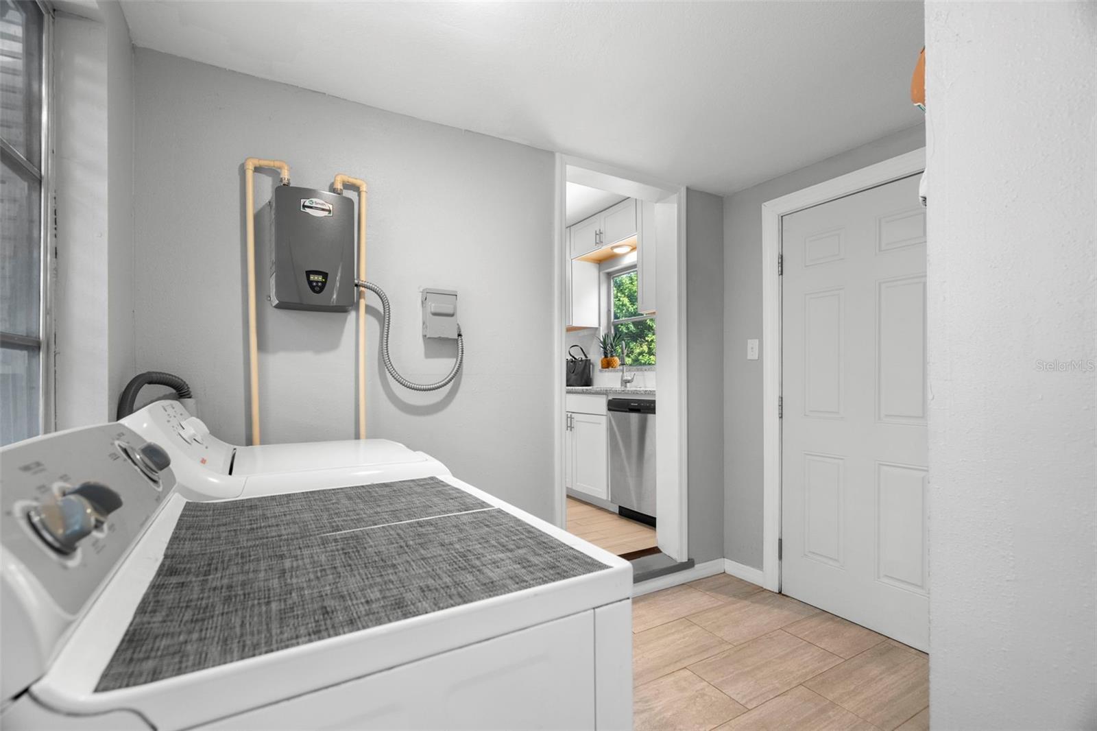 The breezeway, utility room, and second full bath - offers incredible flexibility.
