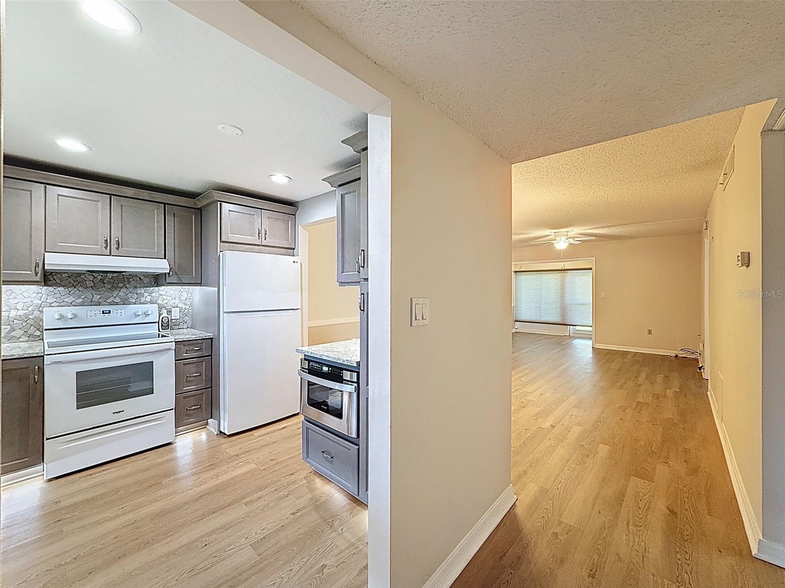 Updated flooring flows seamlessly throughtout the unit (except in the bathrooms)