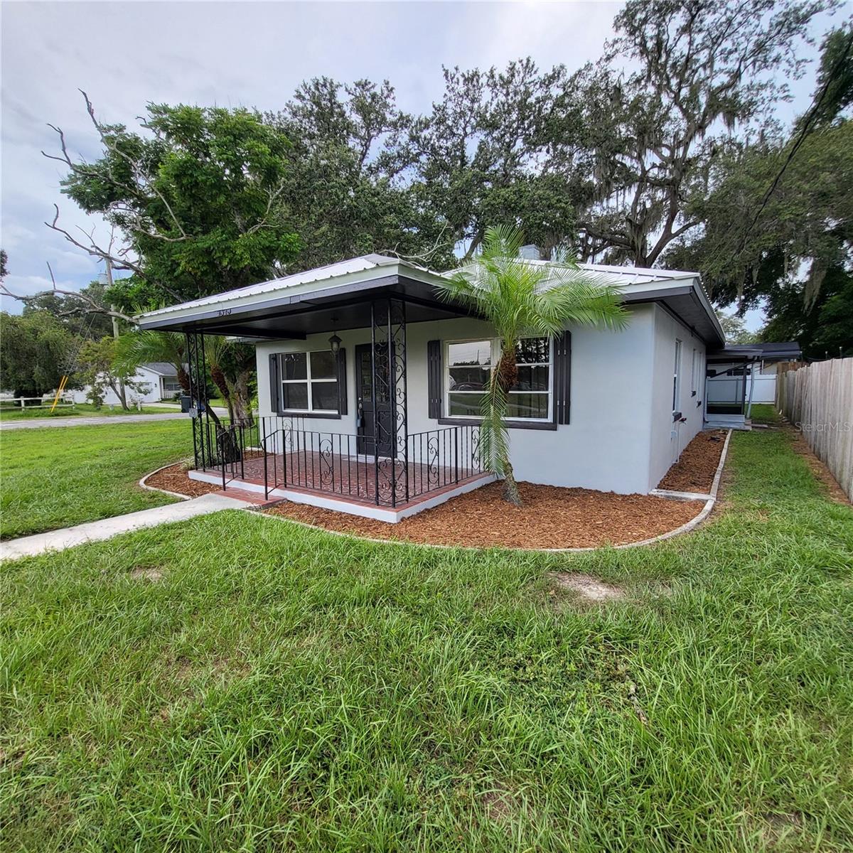 Beautiful curb appeal with freshly painted exterior & recently mulched flower beds awaiting your favorite flowers!