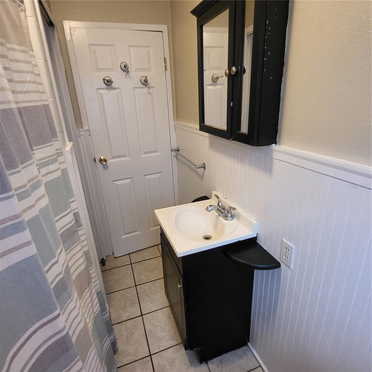 Full bath with single, space saver vanity