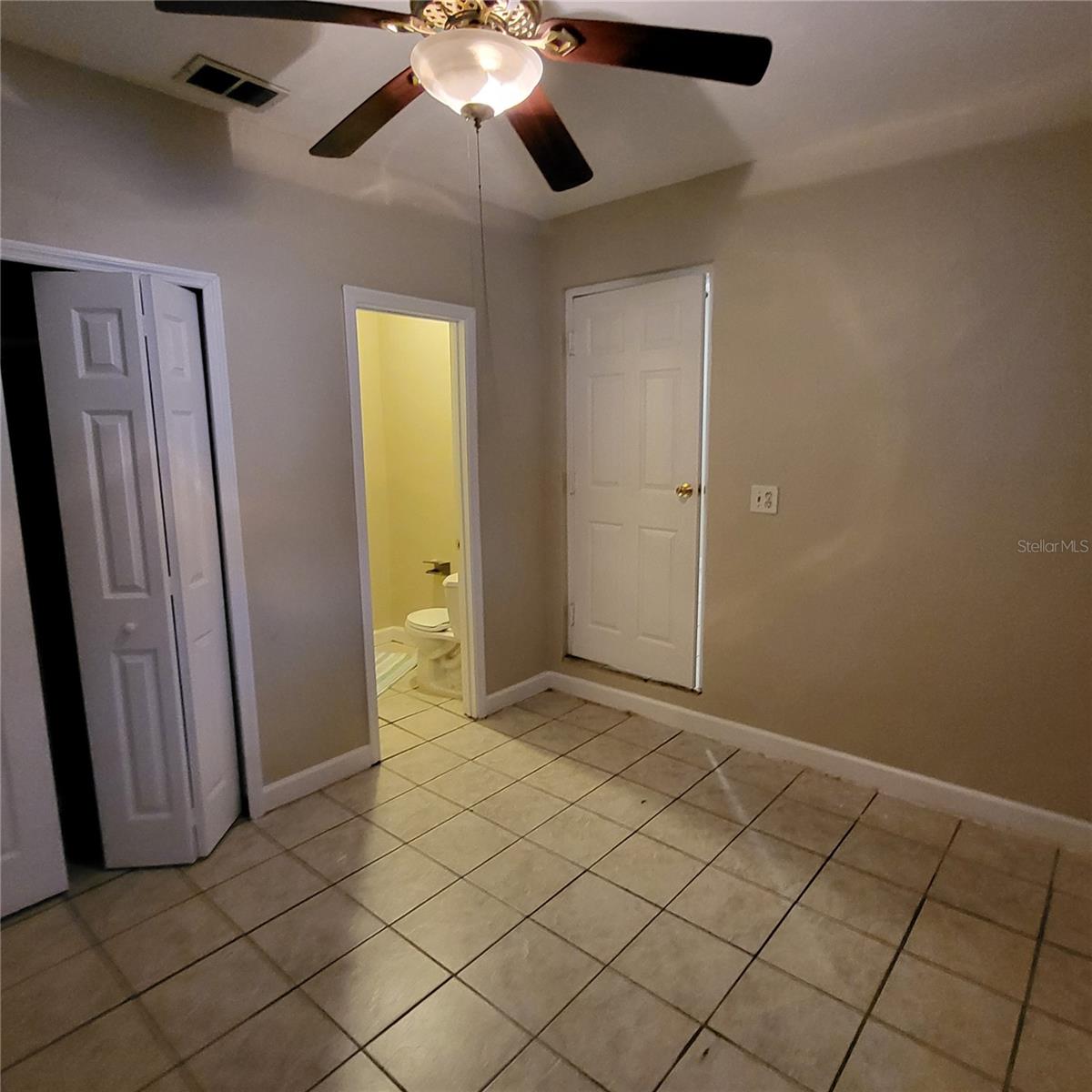 Side bedroom features ensuite powder bathroom and a built in closet.