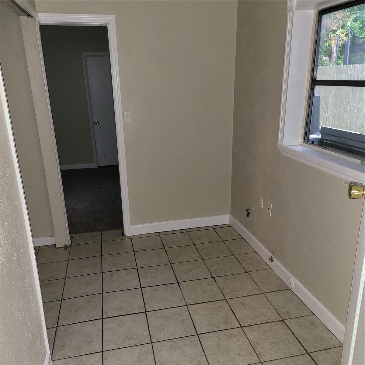 Utility Room with laundry closet has space for extra storage.  Situated between bonus room and primary bedroom