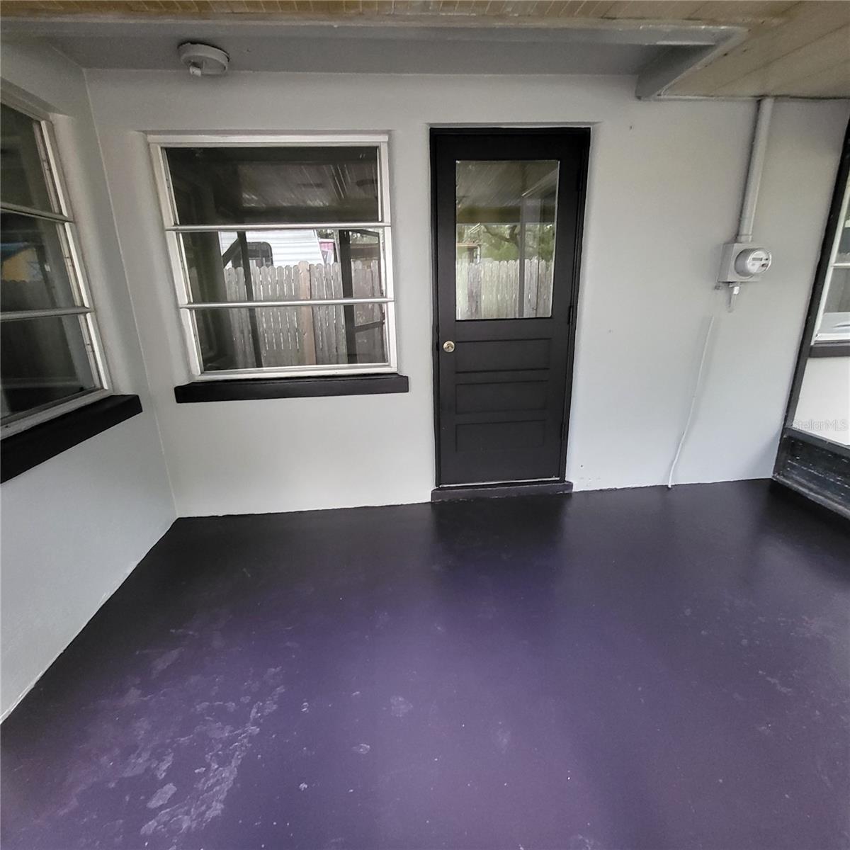 Covered, screened back patio off the bonus room