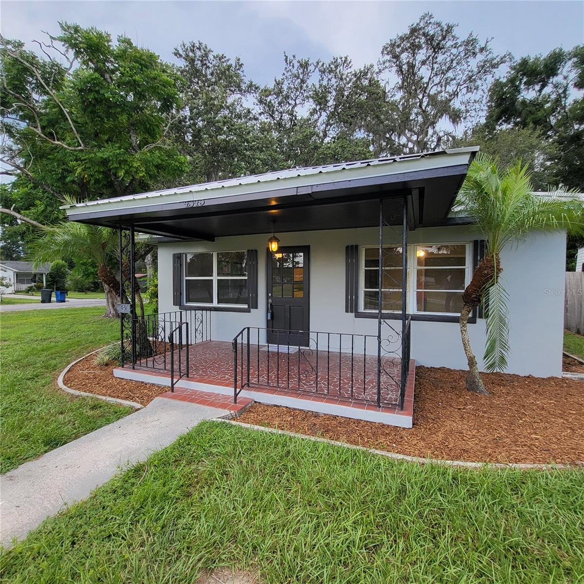 Beautiful front porch has plenty of room for patio furniture.