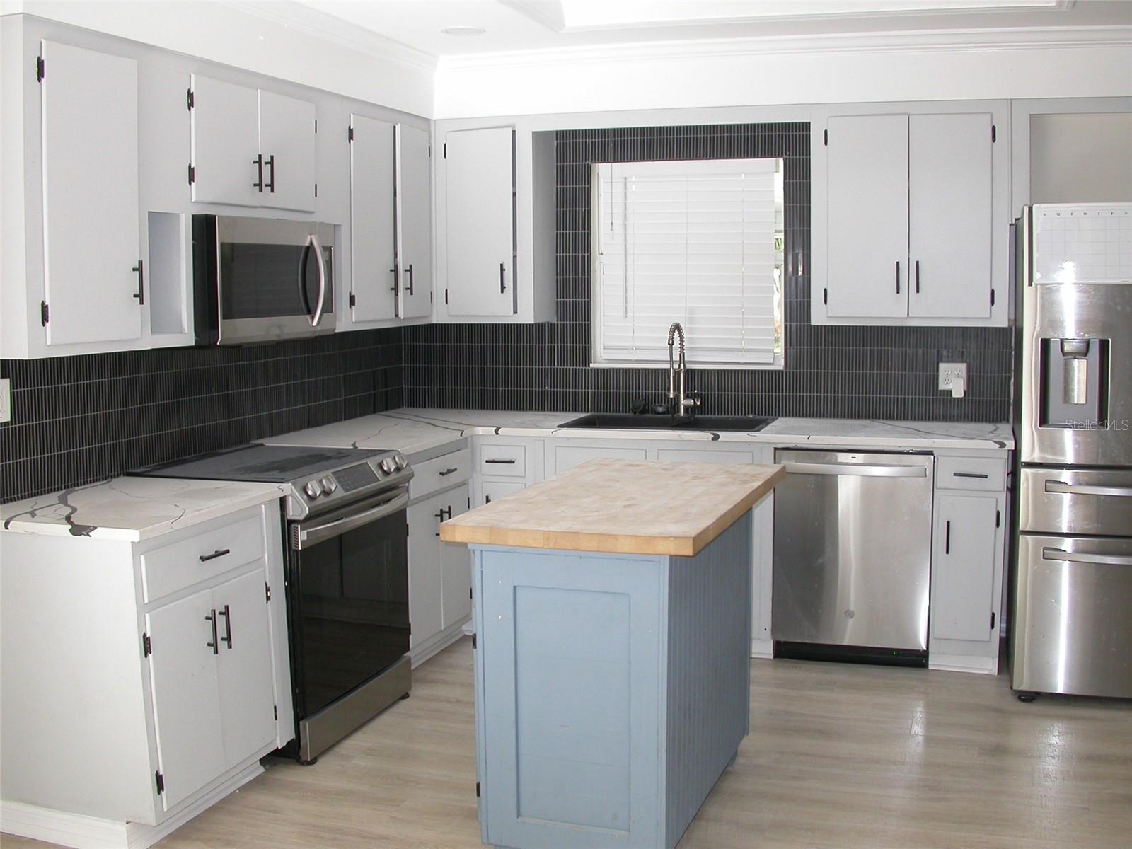 Designer Kitchen with Stainless Steel Appliances