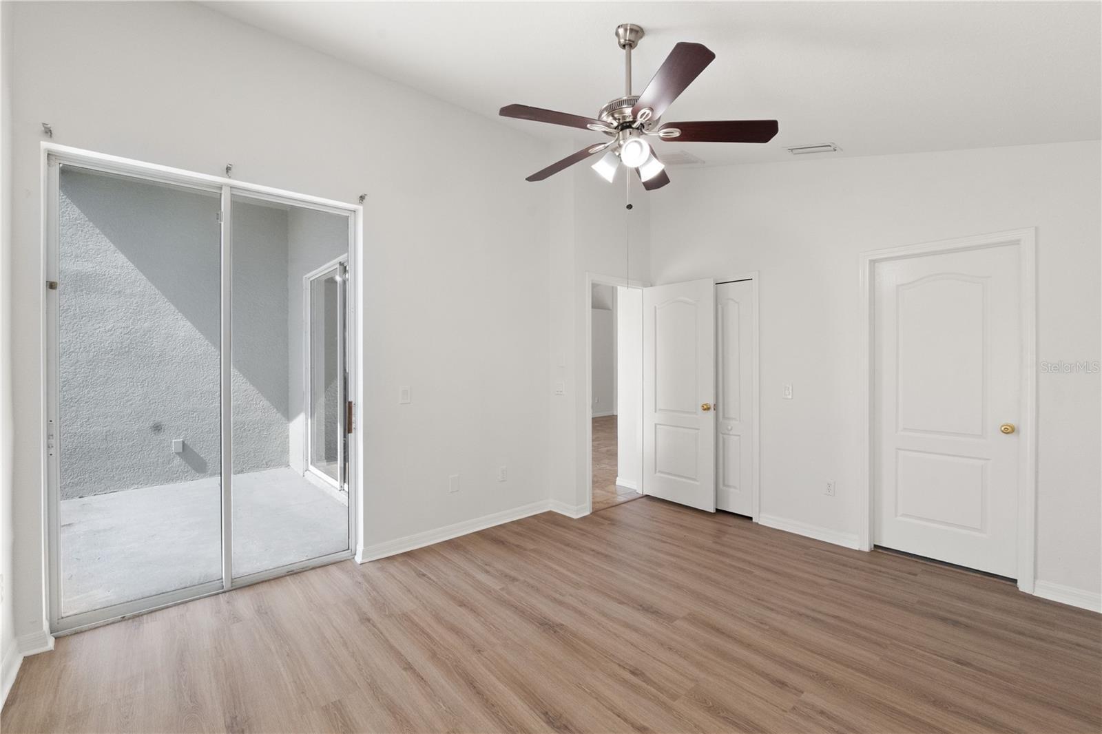Primary Bedroom with access to back patio