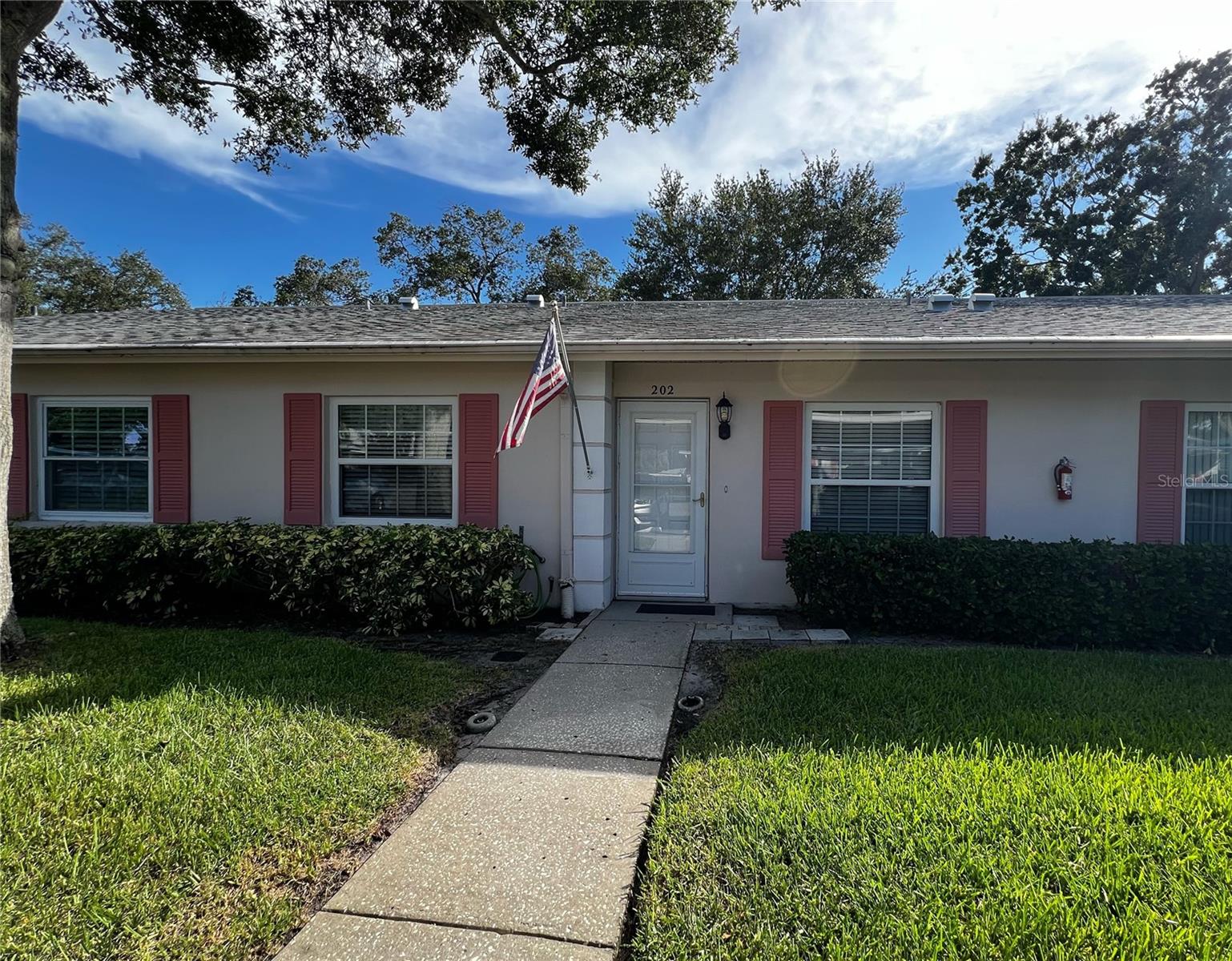 Front entrance into the condo with parking just steps from your door.