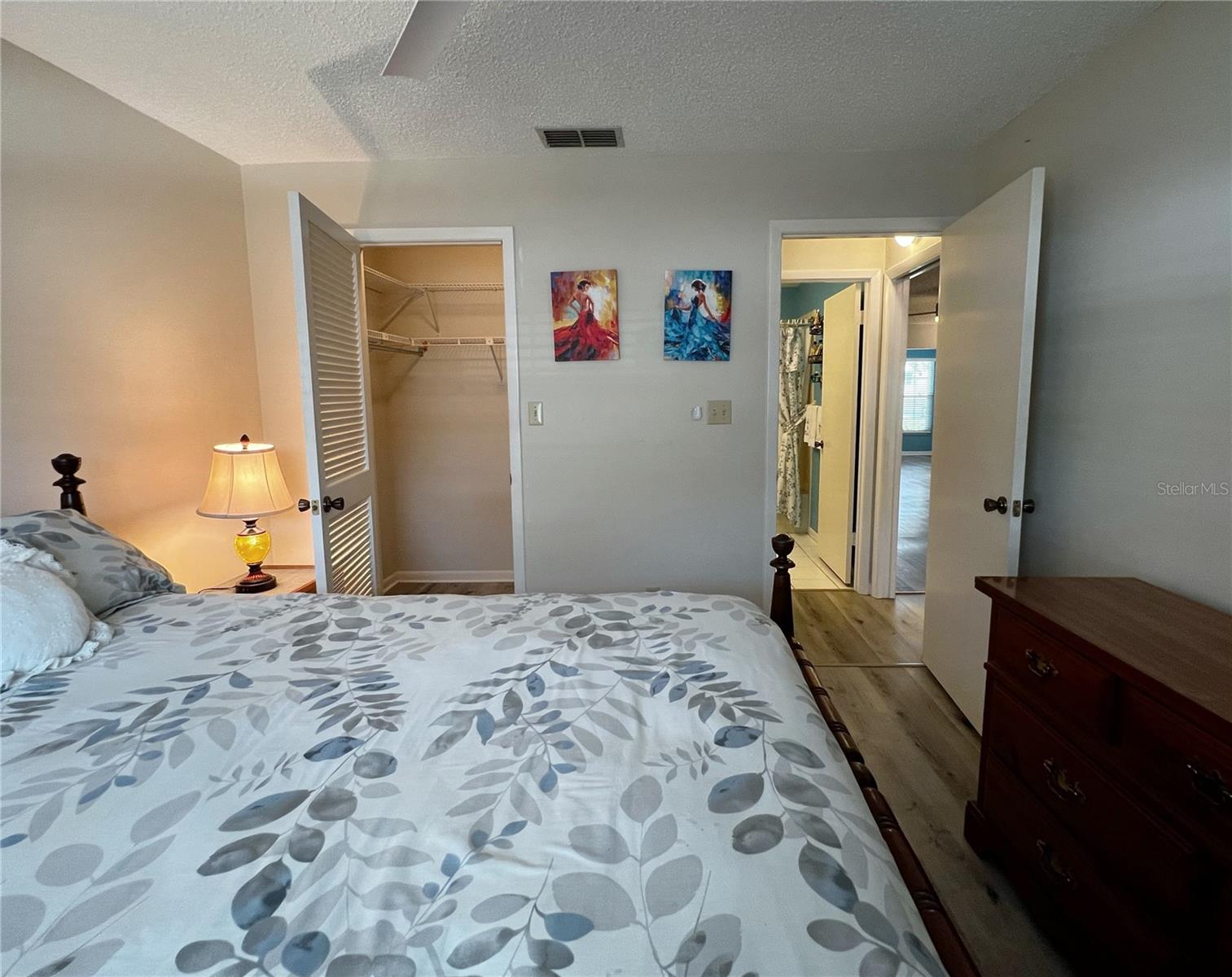 View of the second bedroom and walk in closet. this section of the condo has a pocket door if you would like to make this a second master suite.