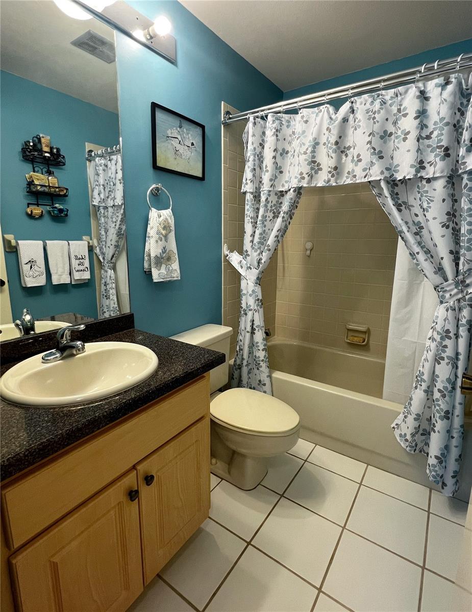 Second bathroom with a tub/shower combo.