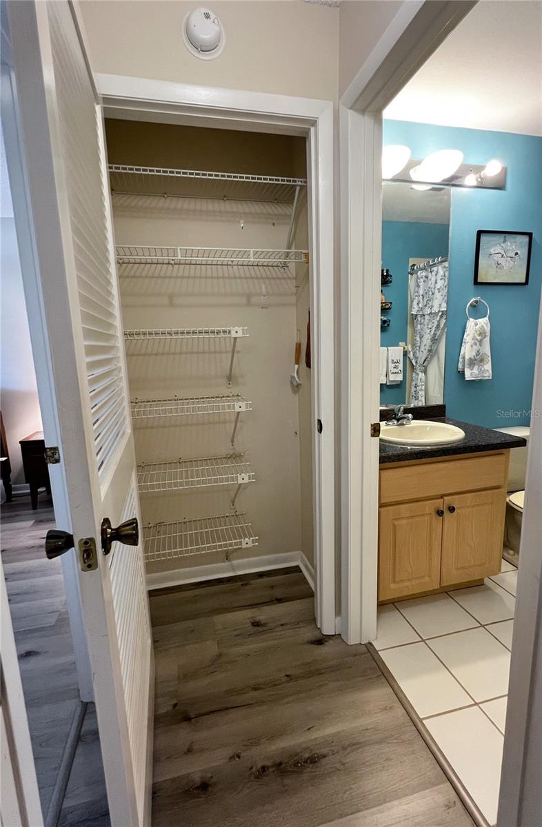 Linen closet between the second bedroom and bathroom.