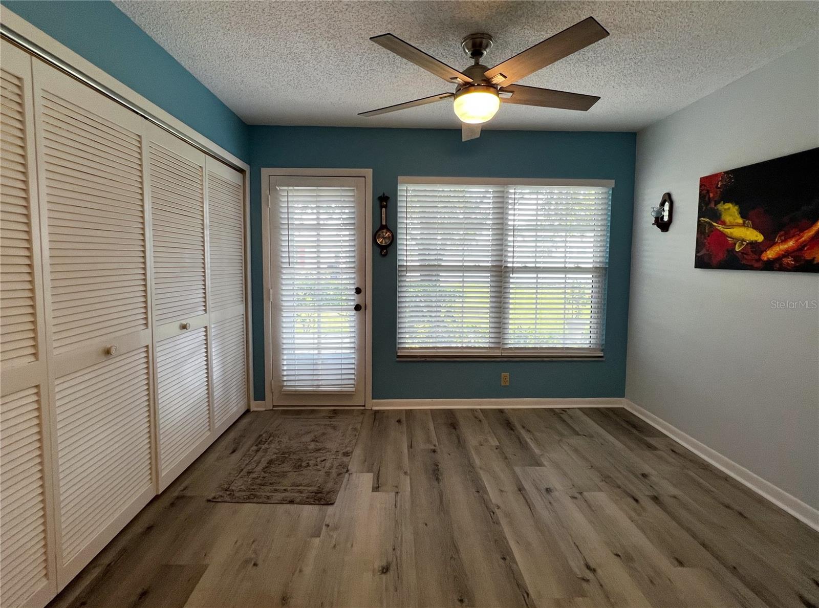 View of the sunny Florida room at the rear of the condo.