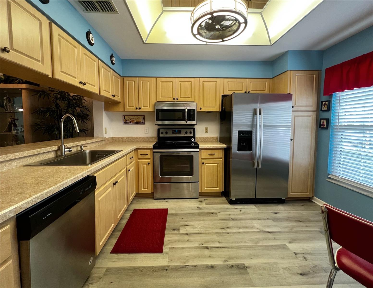 The updated kitchen with stainless steel appliances is located at the front of the condo.