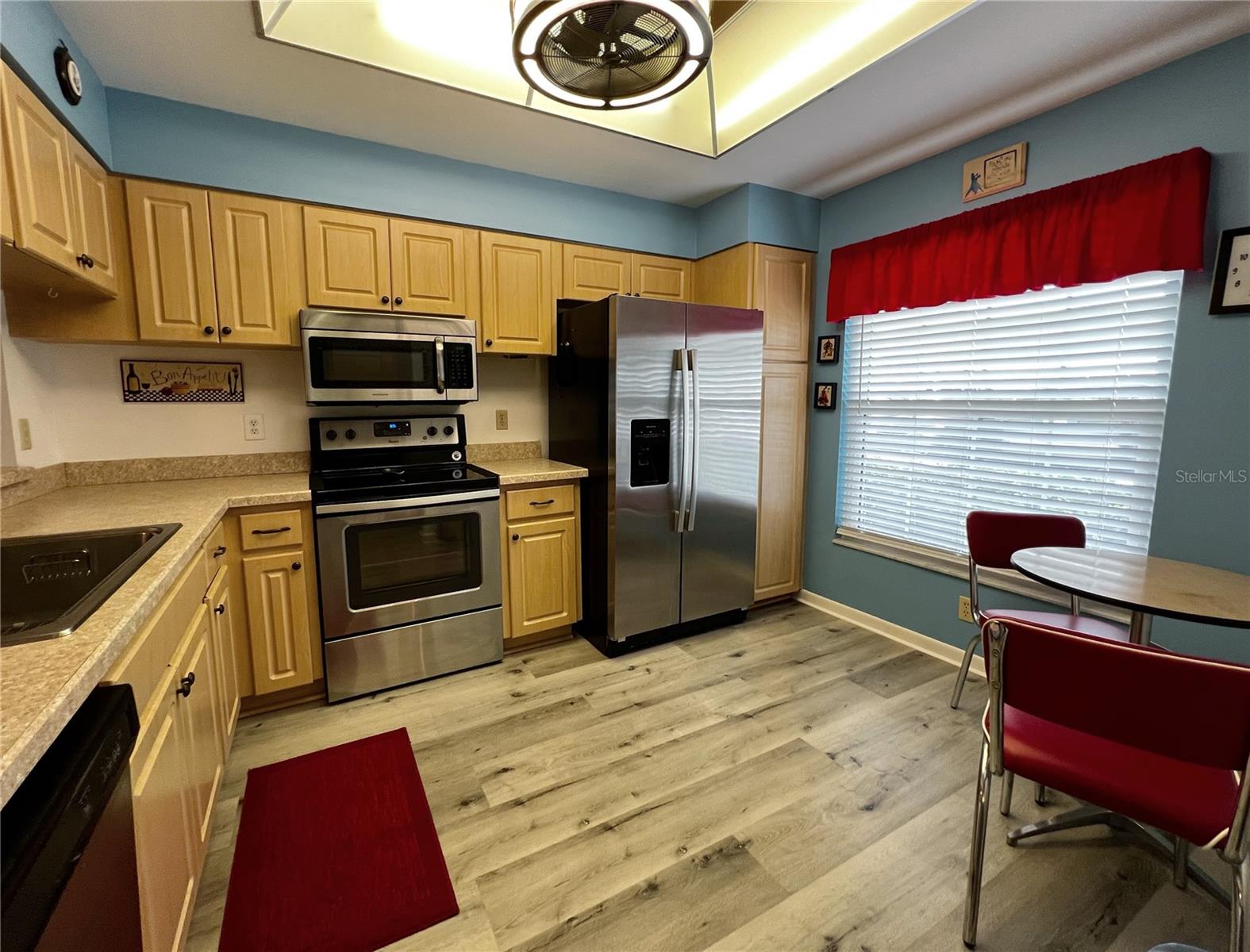 Another view of the updated kitchen with room for a breakfast table.