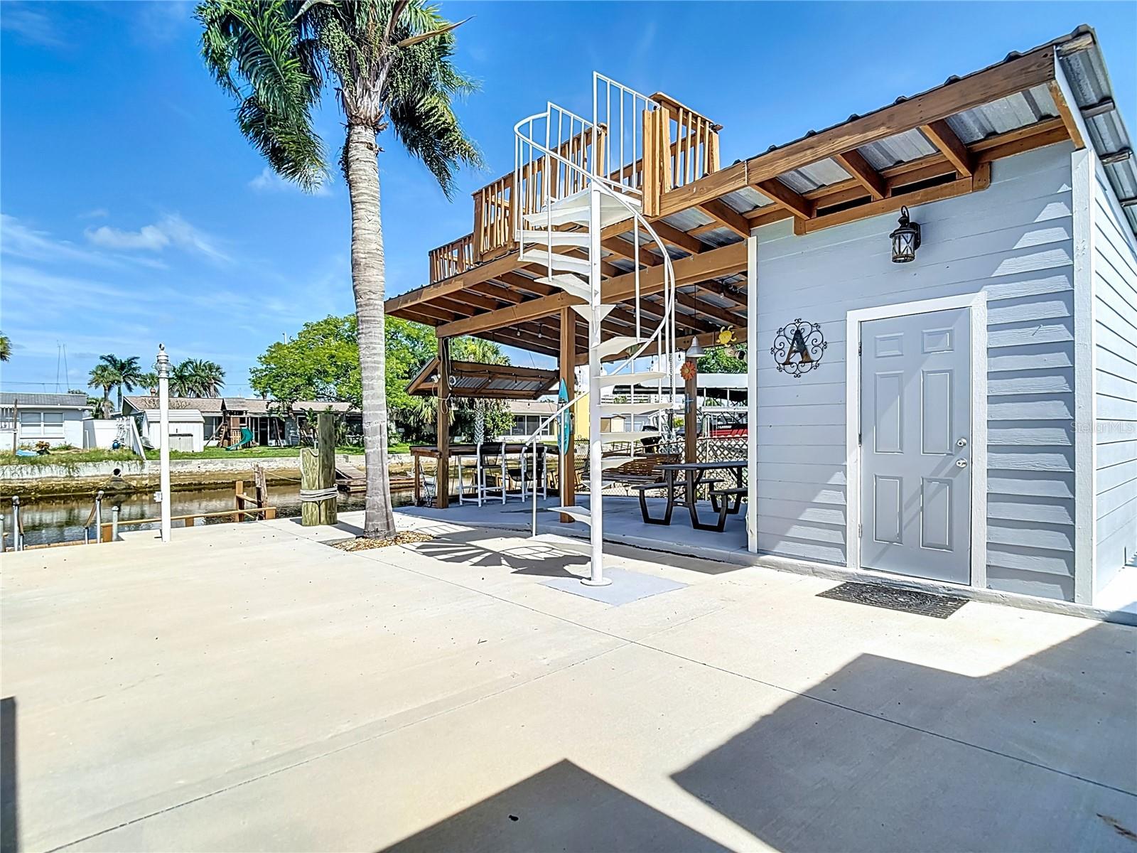 Storage shed and cabana and upper decking area.