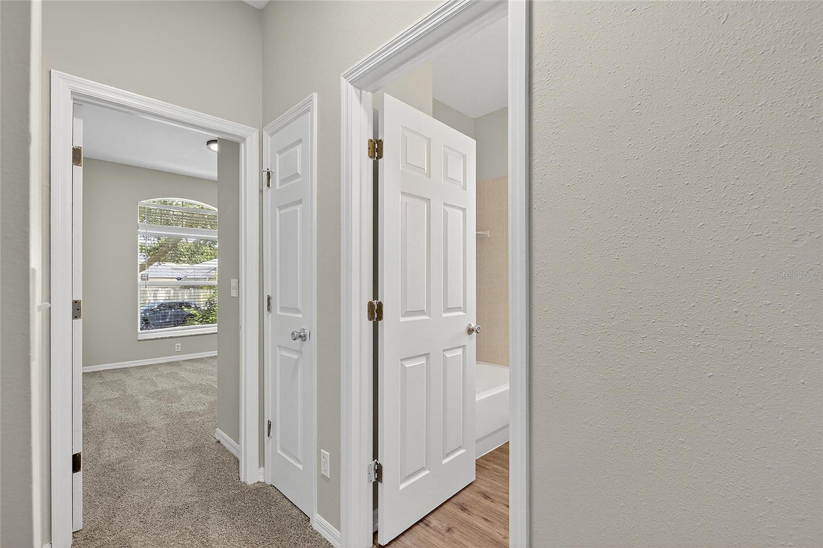 Entrance to wing with two secondary bedrooms and one full bath (1st floor)