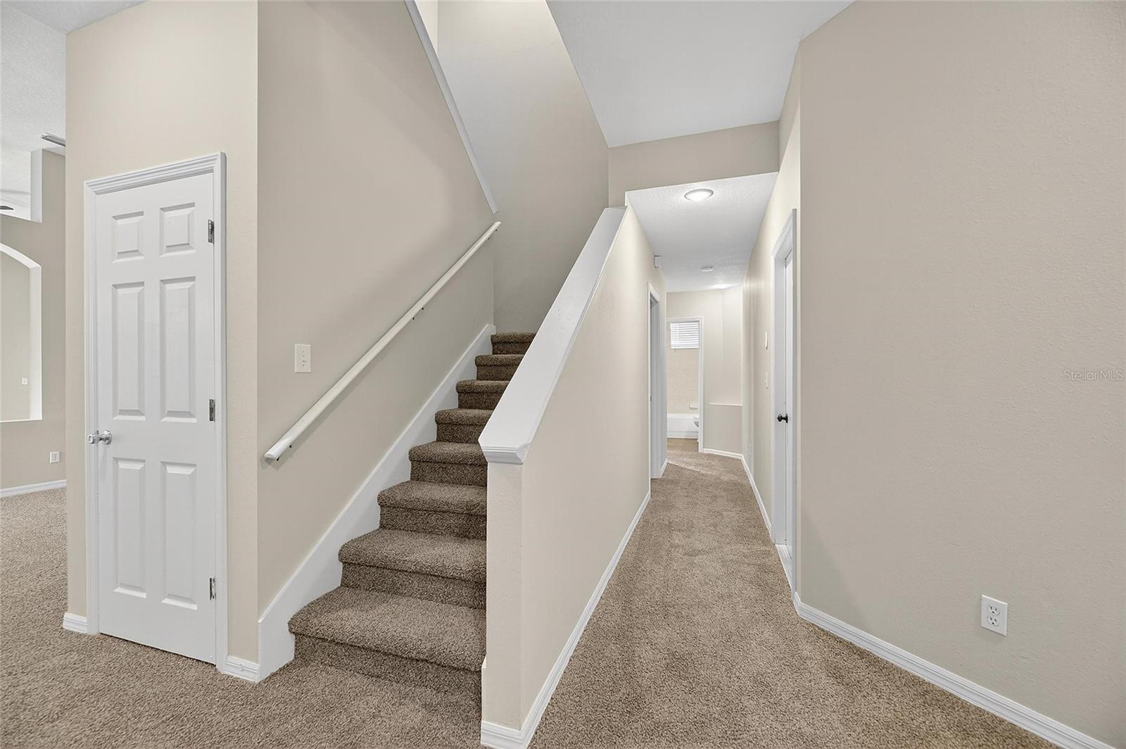 Hallway to the right to the laundry room and Bedroom 4 (first floor)