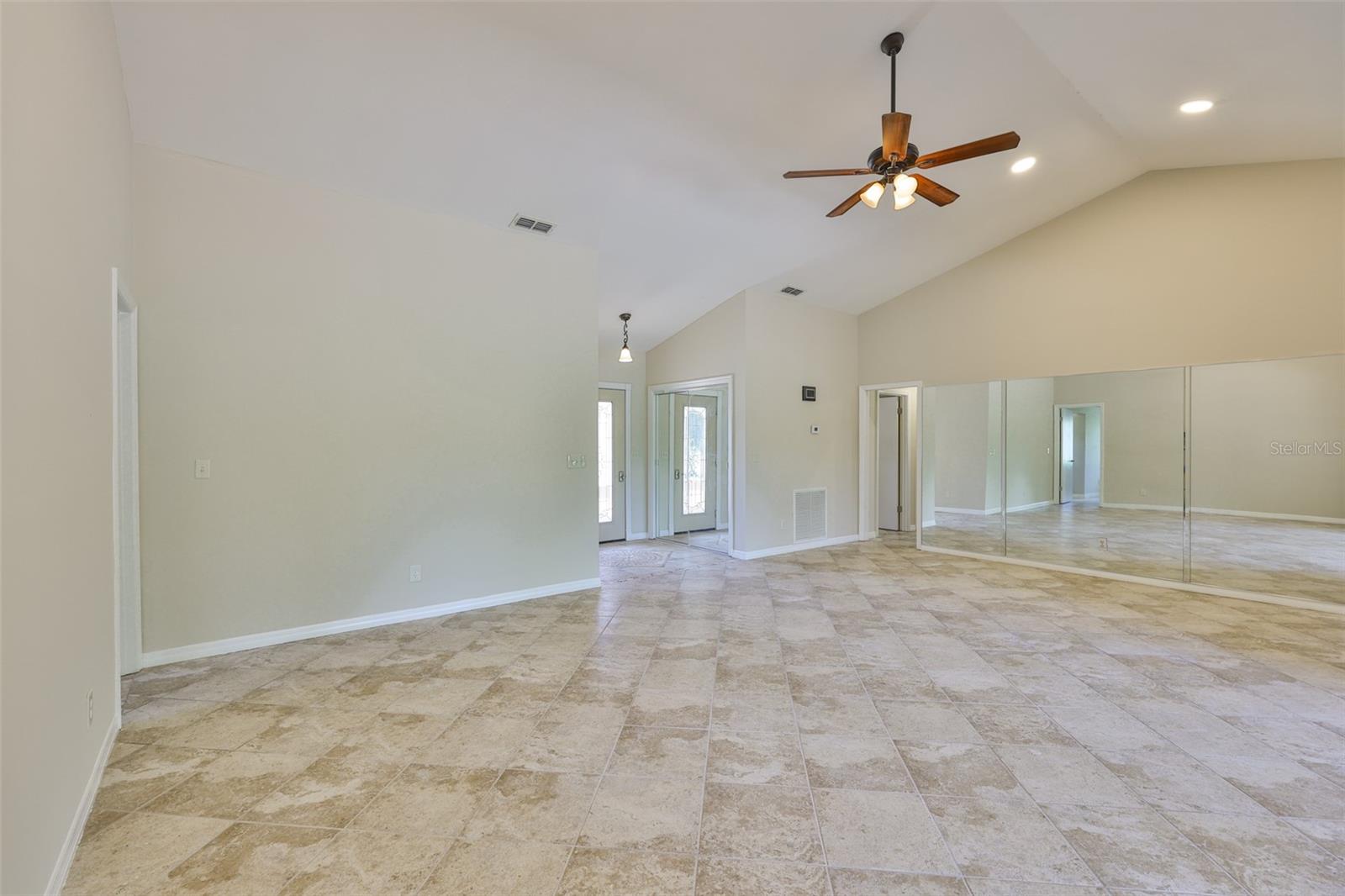 Cathedral Ceilings throughout the great room with recessed lighting offer a sense of grandness to the home.