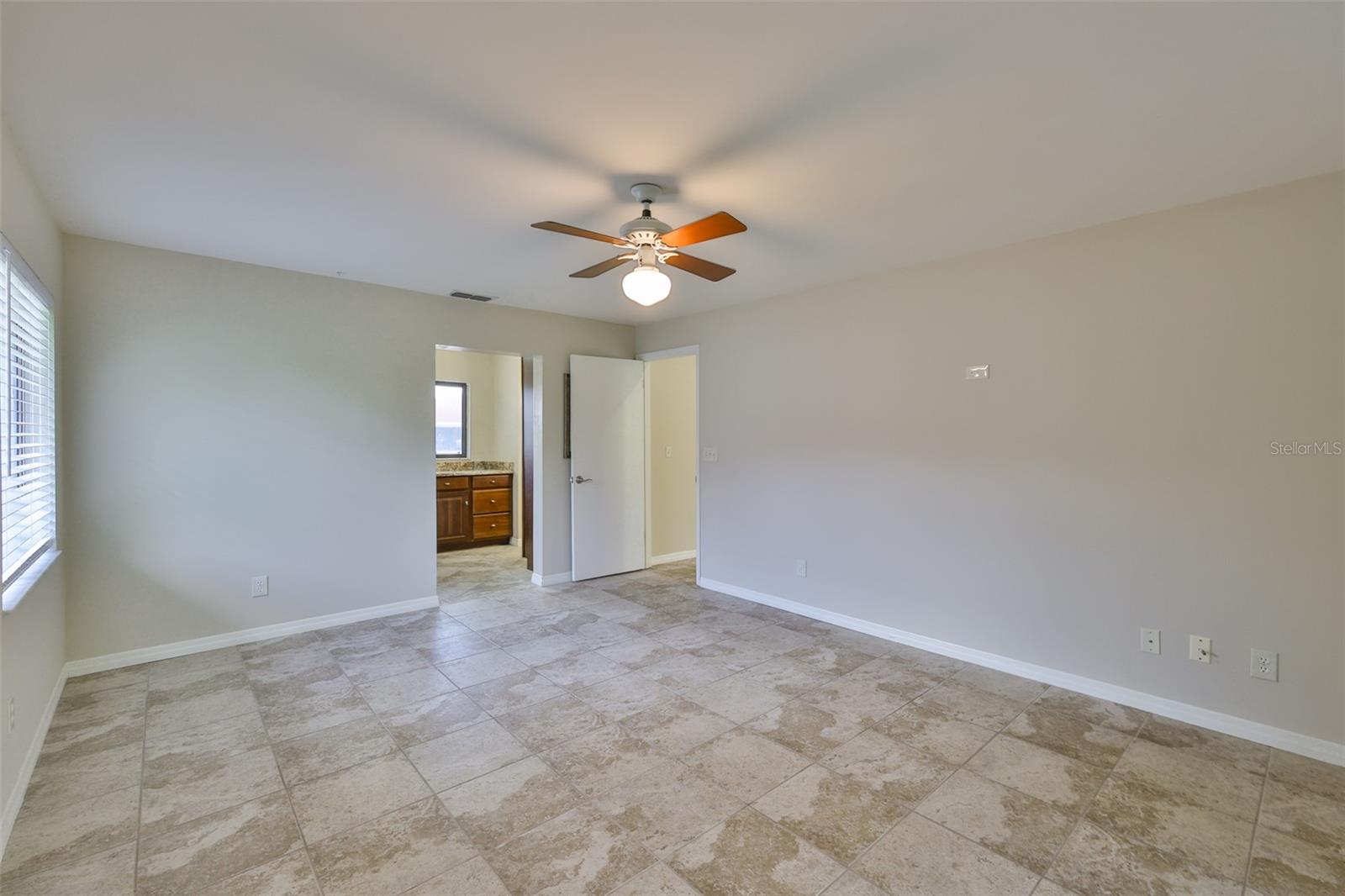 An ensuite bathroom, walk-in closet, and dressing station offers lots of extra storage and privacy.