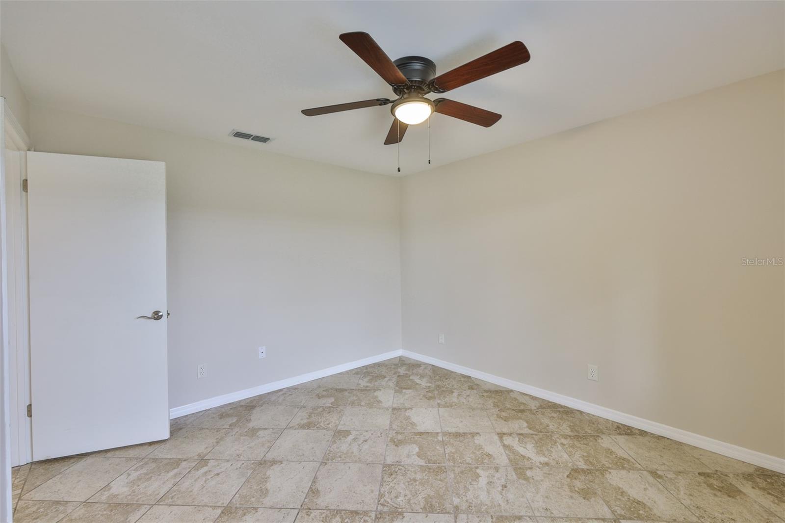 Bedroom #2 has matching ceramic tile throughout.