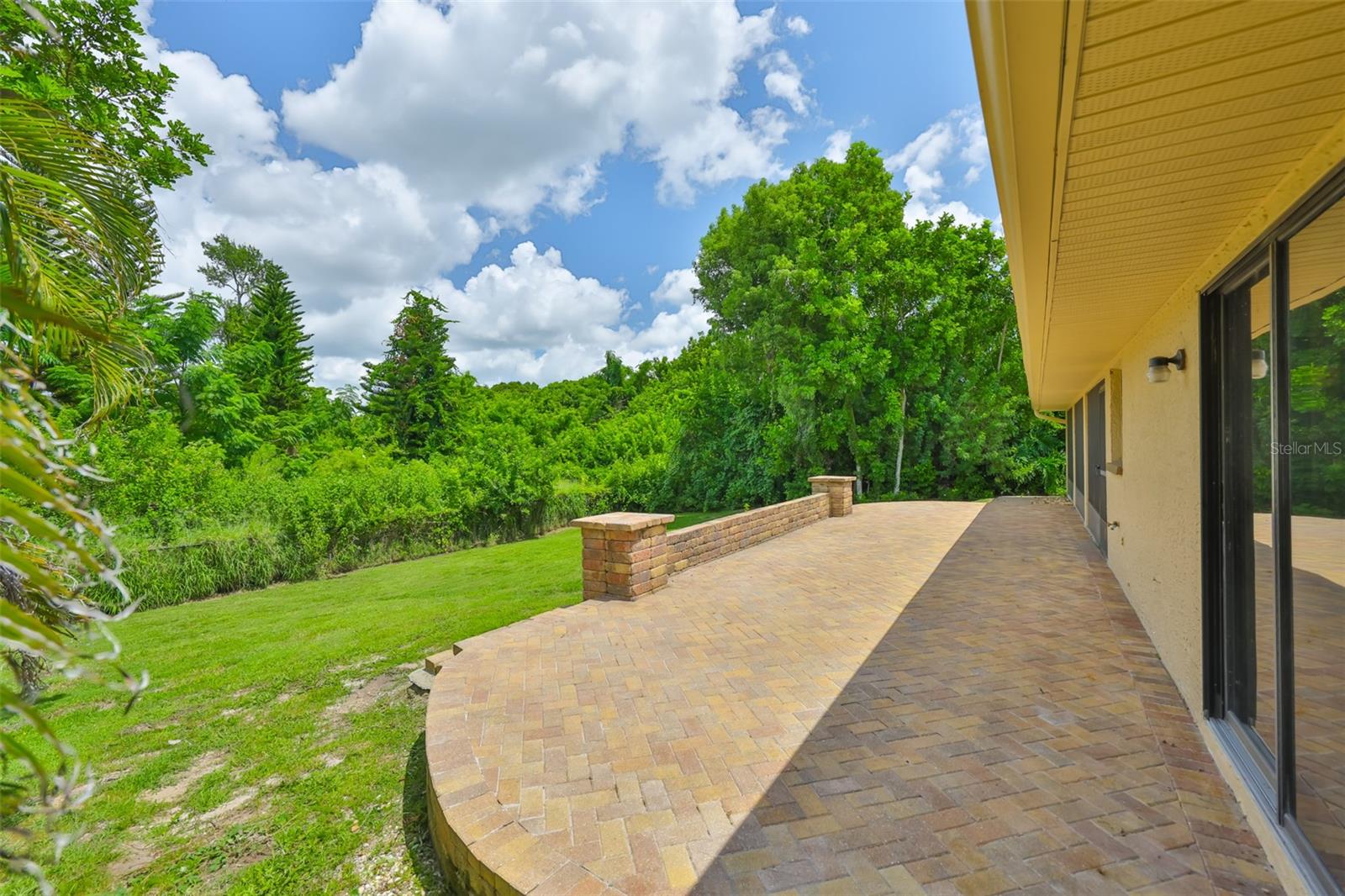 A customized paved open-air  patio with a private view would be perfect for a cozy firepit.
