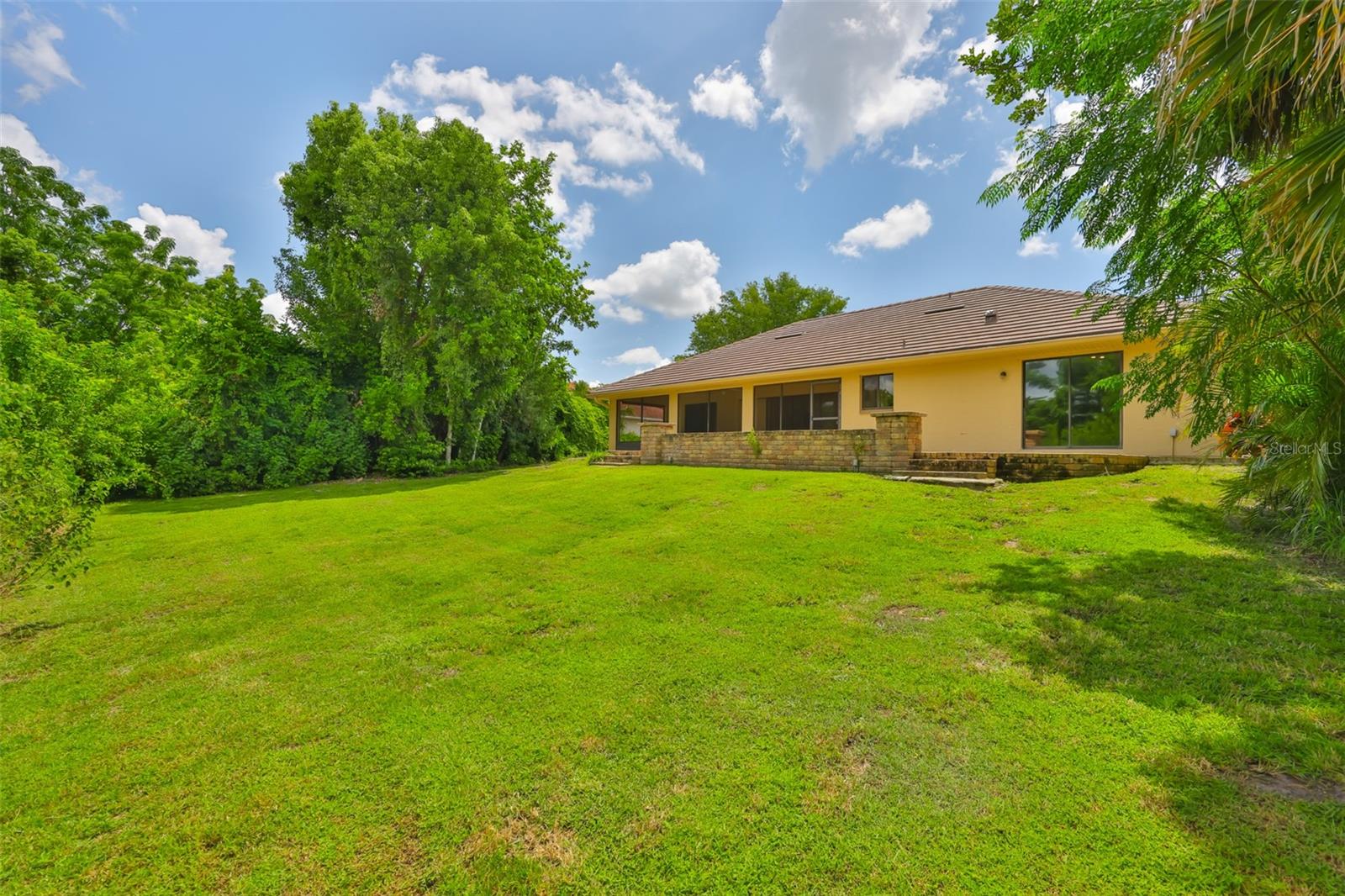 Nestled on a private, tree-lined lot, you'll enjoy complete tranquility surrounded by nature.
