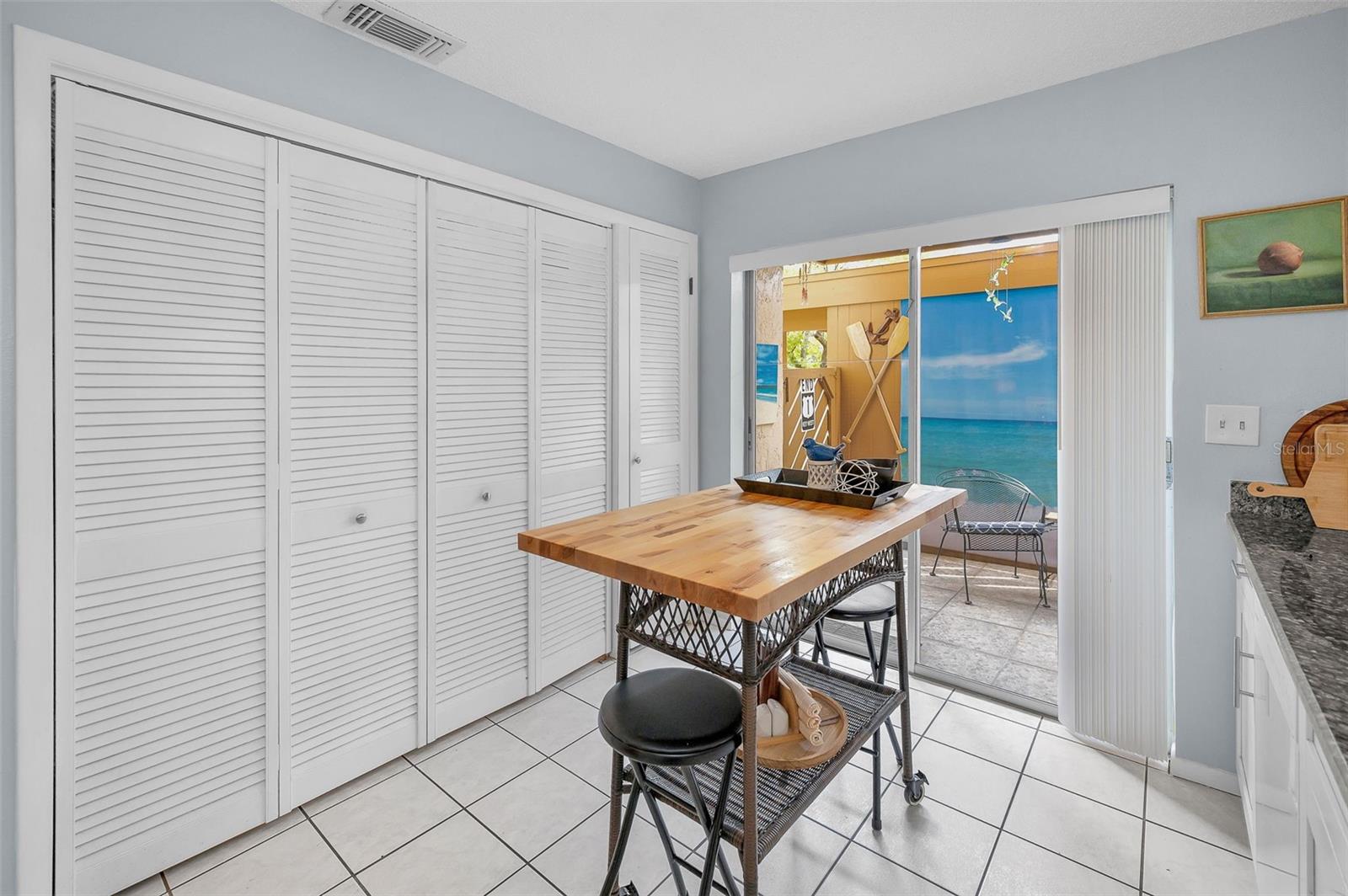 Sliders to the Front Lanai & covered Carport/Outdoor Storage Closet