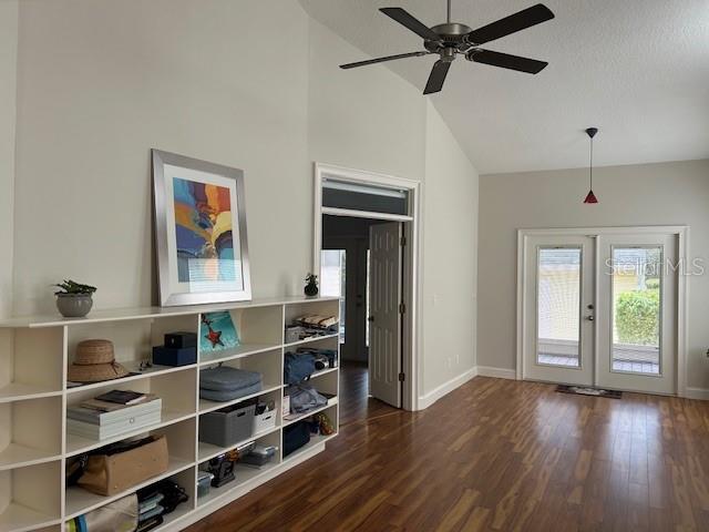 Family room with build-in shelving. Entry double doors leading into master bedroom.