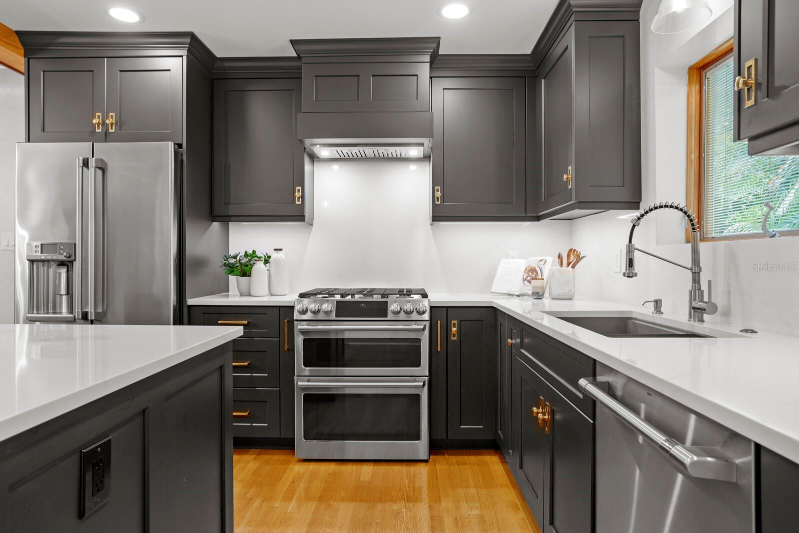 Quartz countertops and full-height backsplash