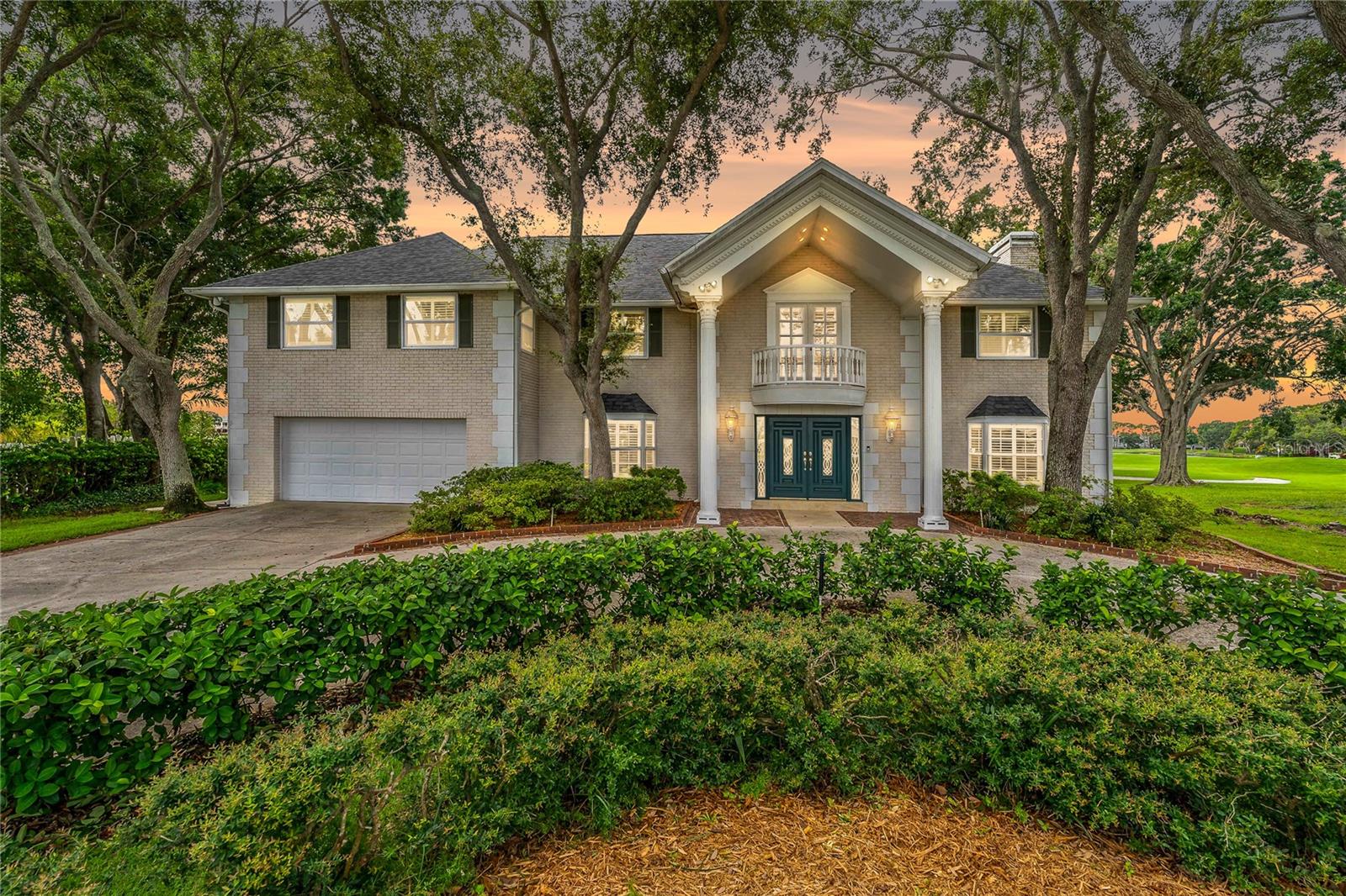 COLONIAL STYLE HOME SITUATED BEAUTIFULLY ON THE FEATHER SOUND GOLF COURSE