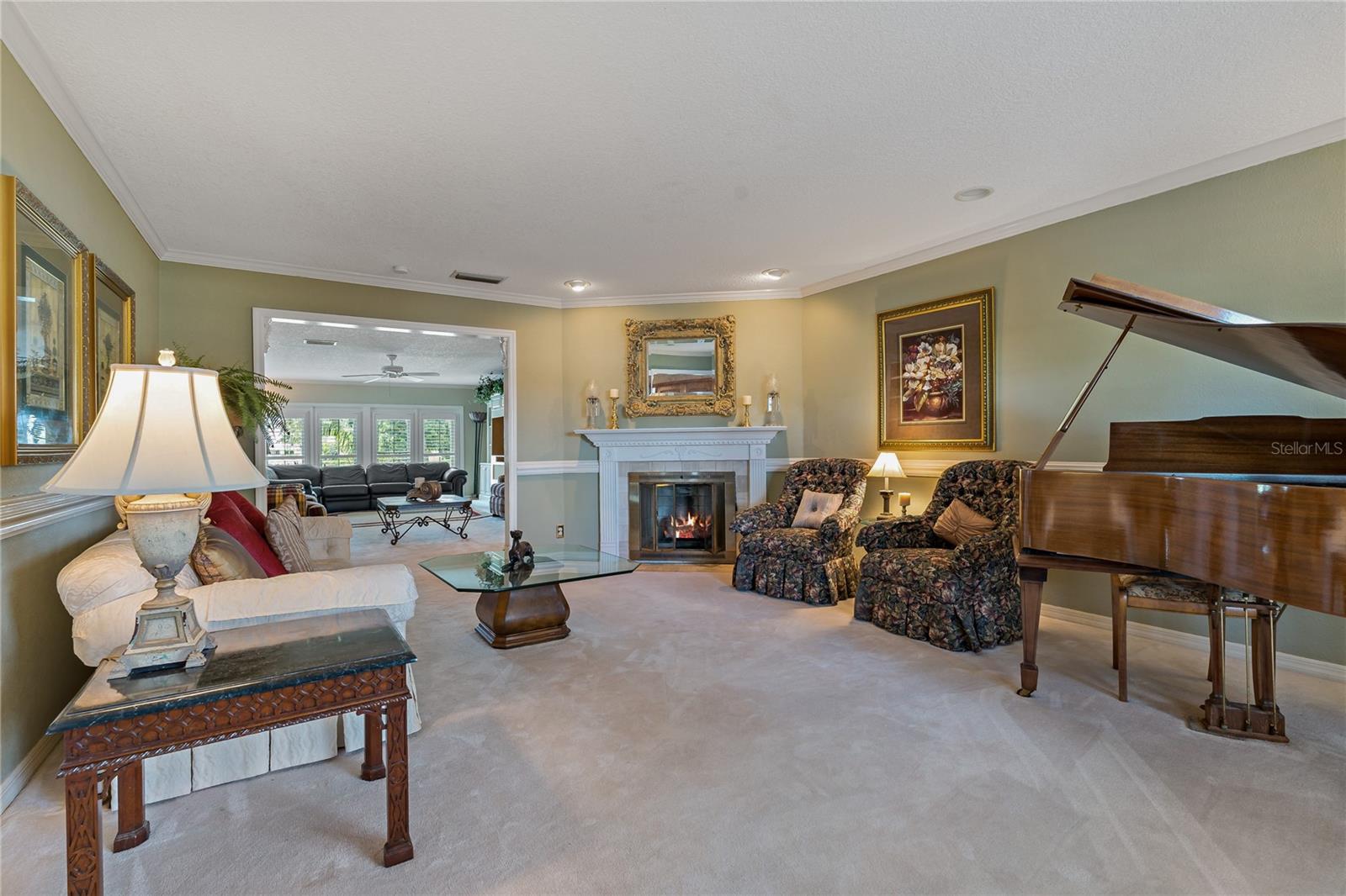 FORMAL LIVING ROOM WITH WOOD BURNING FIREPLACE