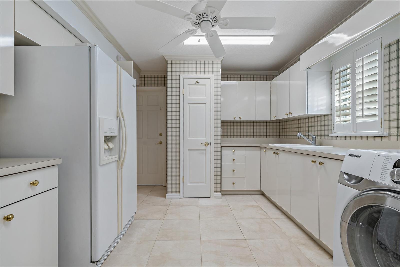 VERY SPACIOUS LAUNDRY ROOM ~ NOTICE THE PLANTATION SHUTTERS THROUGHOUT!