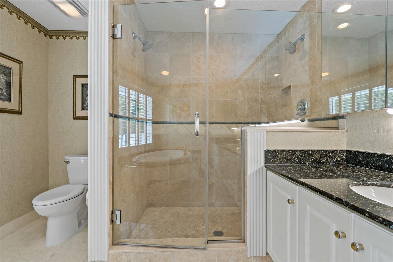WALK IN SHOWER IN THE PRIMARY BATHROOM