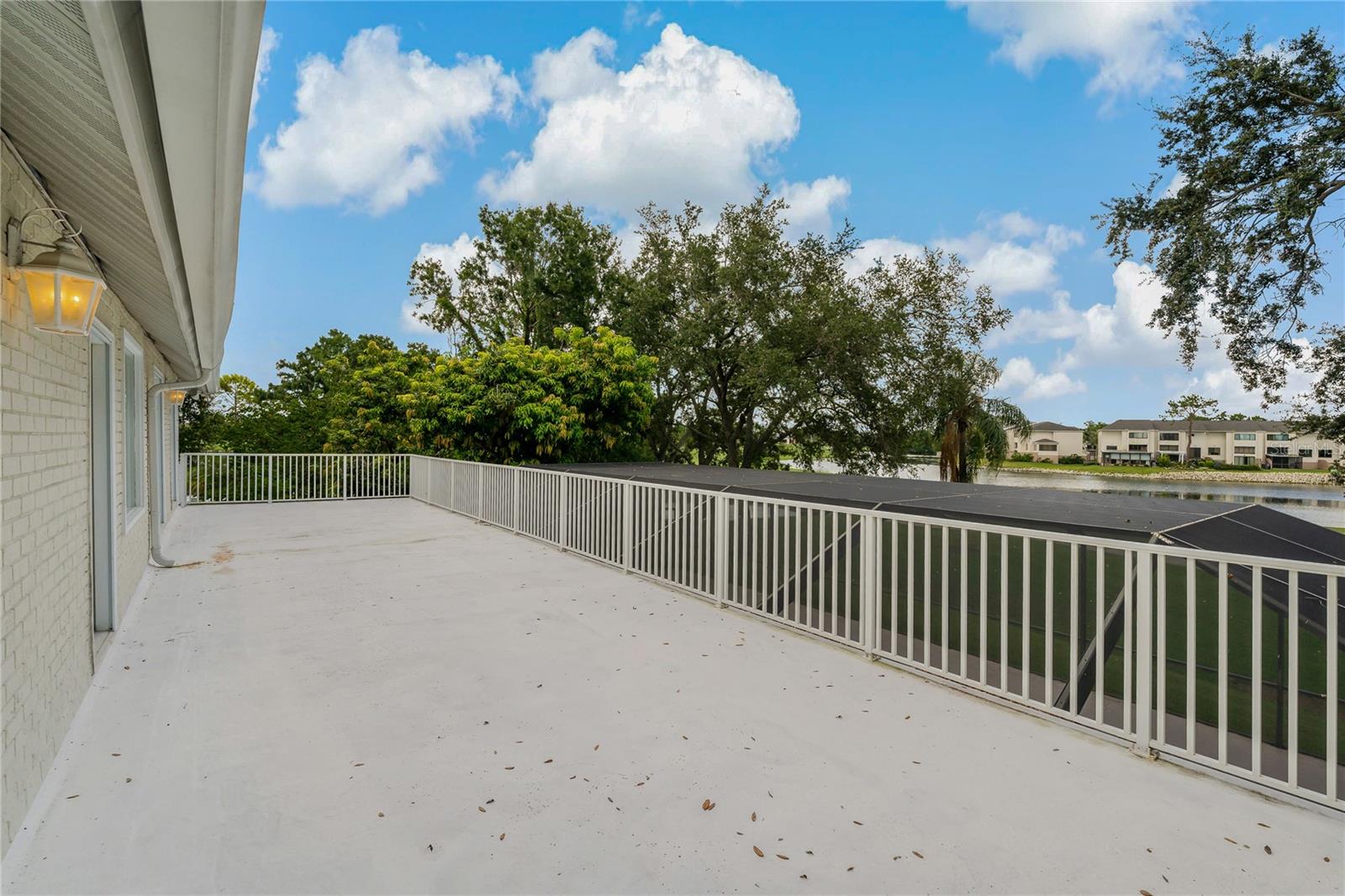 EXPANSIVE SECOND STORY BALCONY OVERLOOKING THE POOL AND GOLF COURSE!