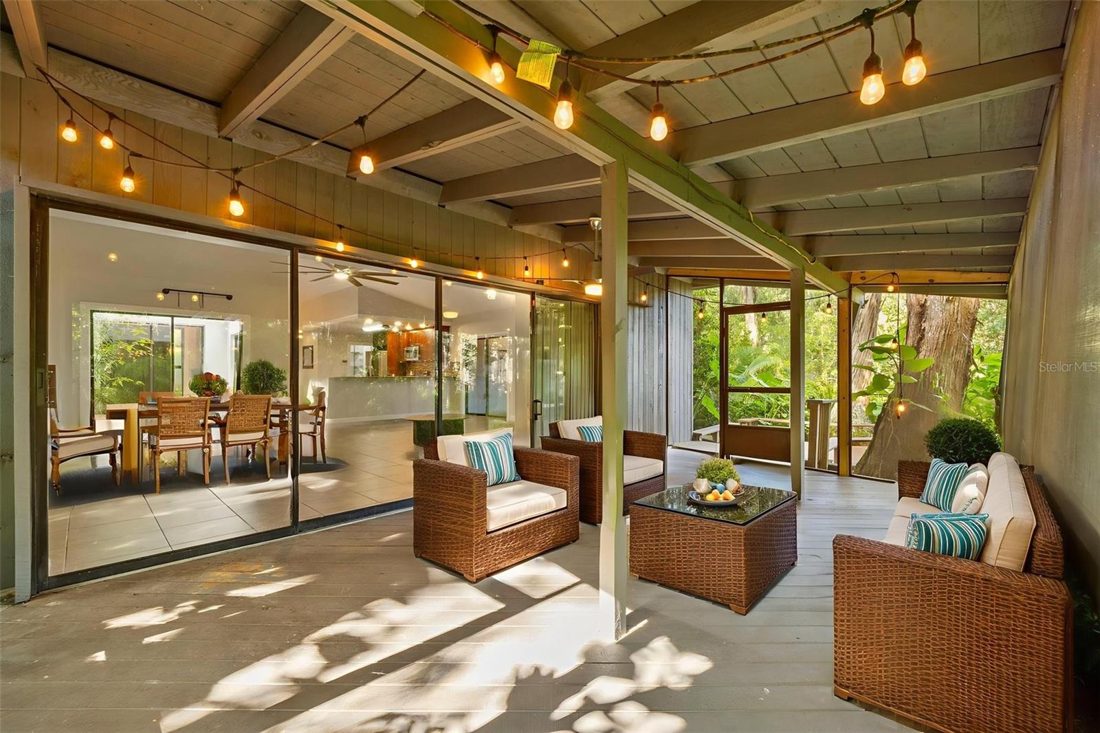 Amazing screened back porch, perfect for watching sunrises, sunsets, and dinner parties.